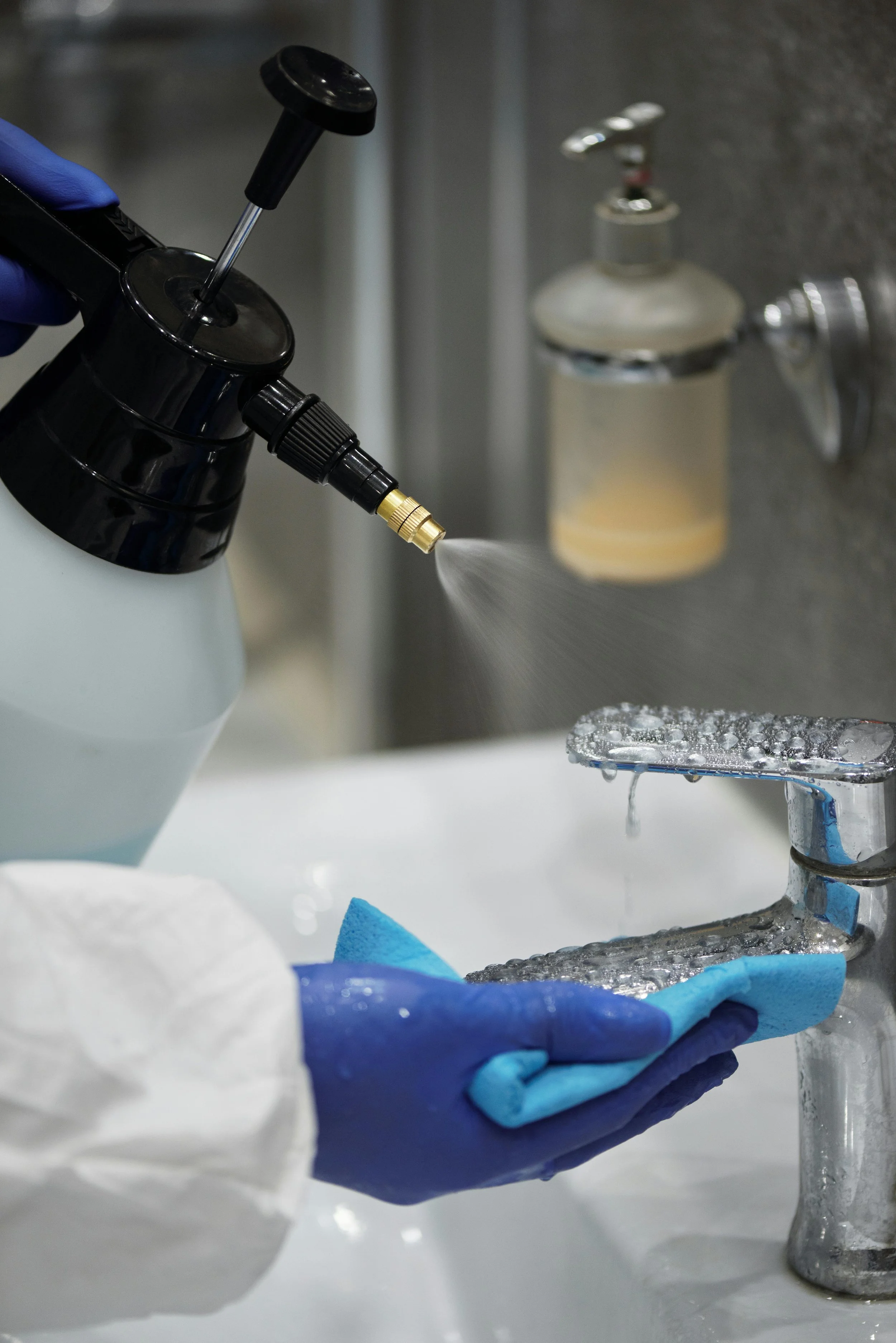 Disinfectant spray being used to sanitize a commercial surface