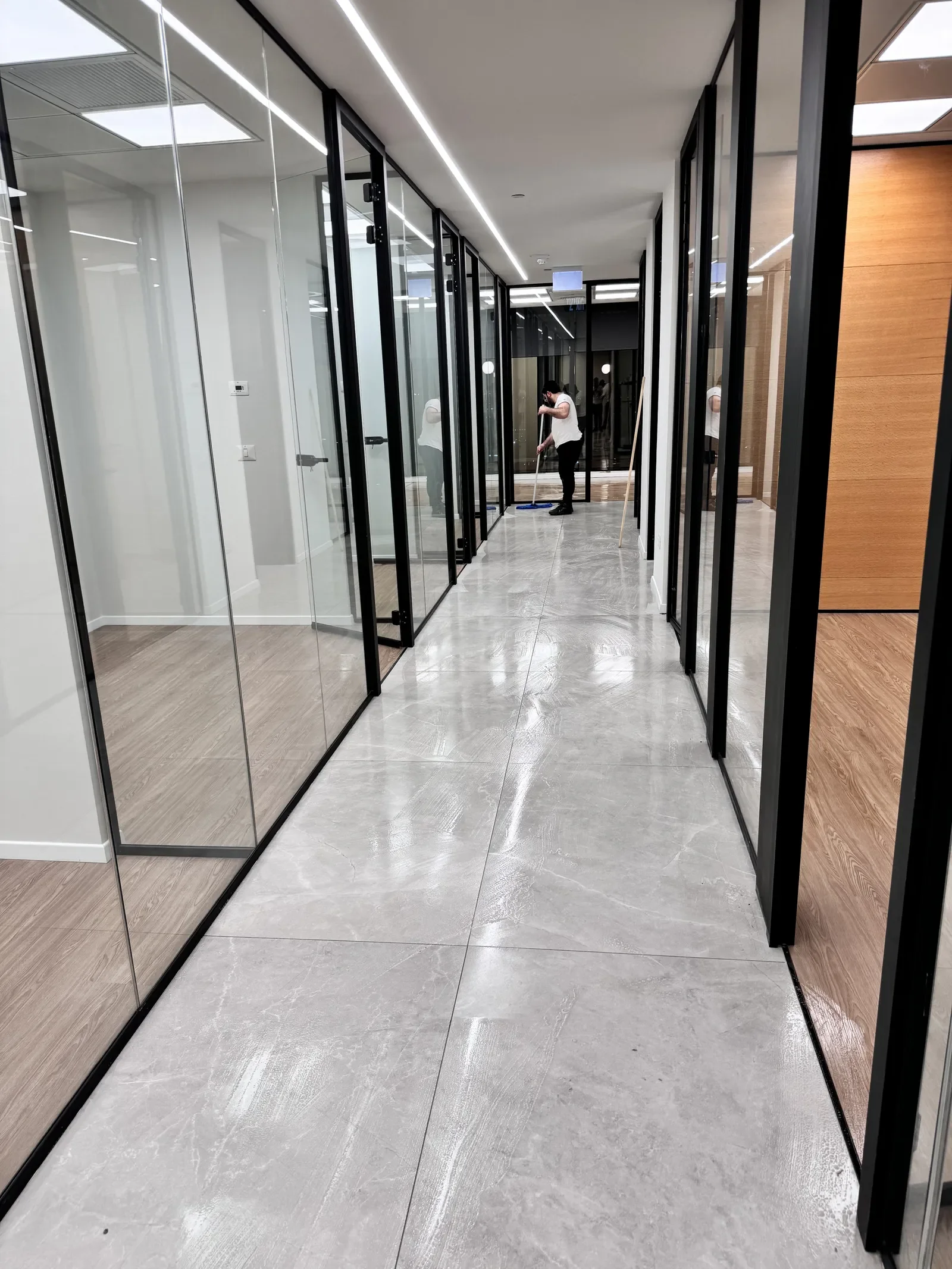 Professional cleaner mopping company tile floor