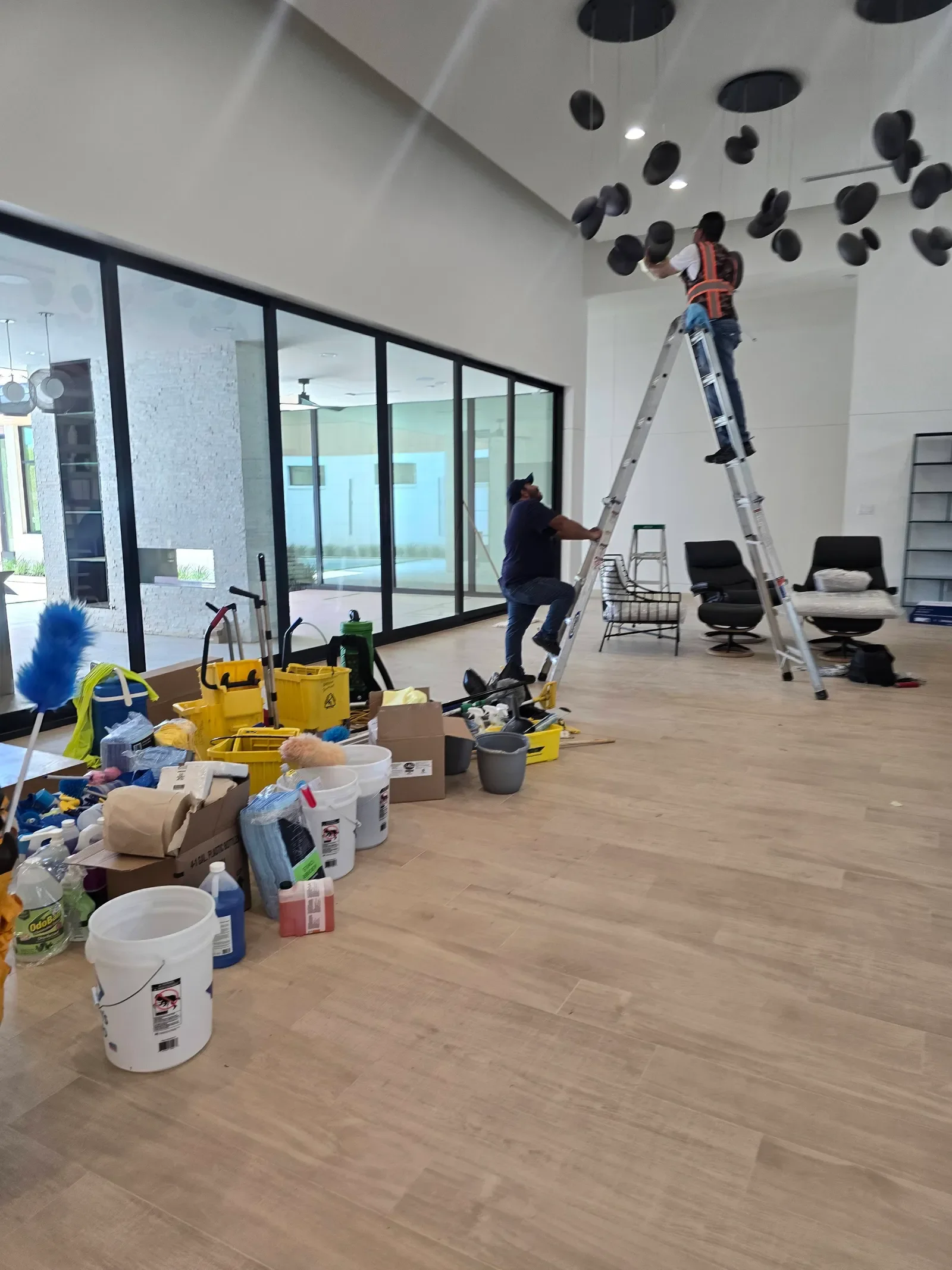 Professional cleaner wipping ceiling