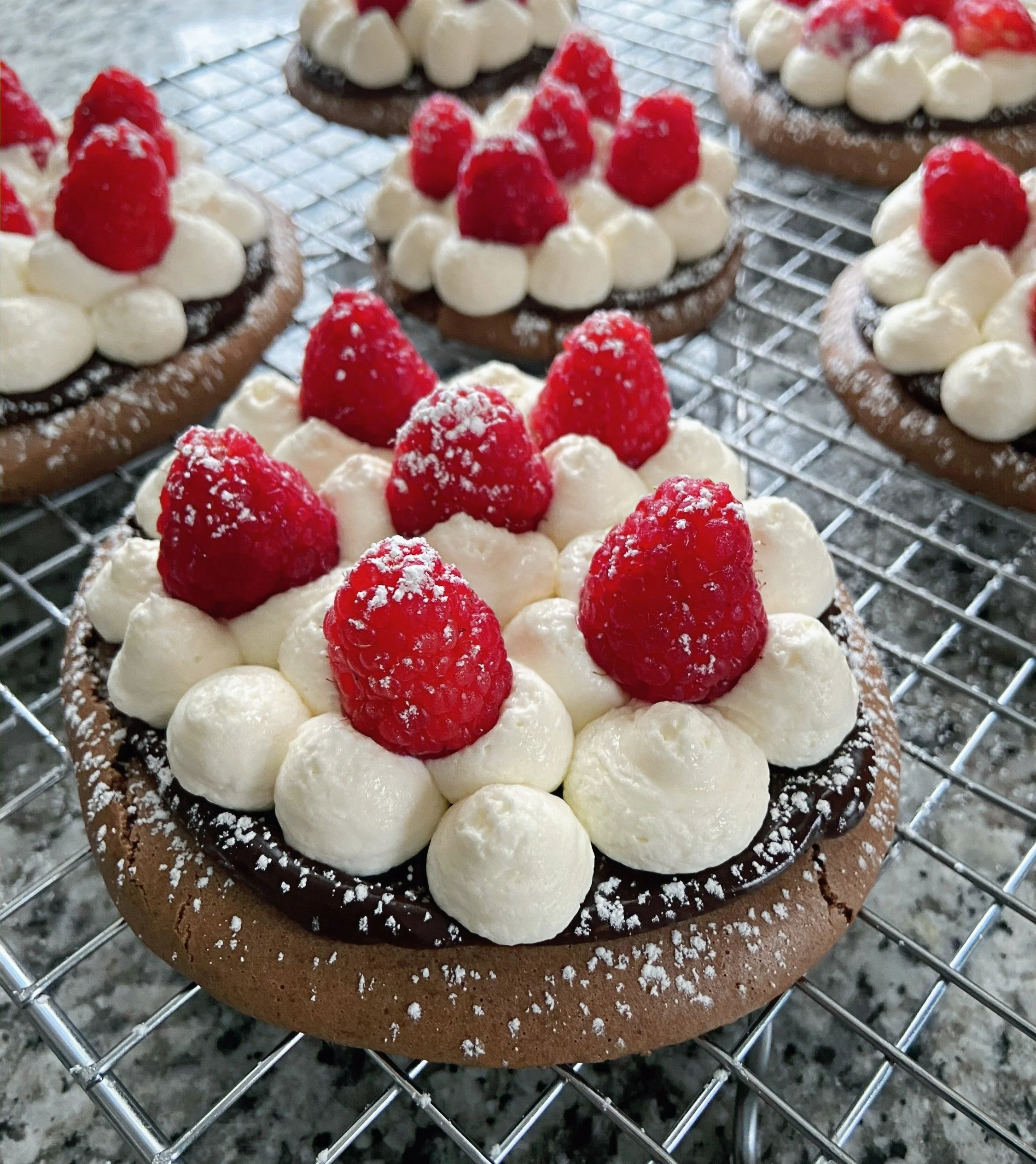 chocolate macaron tartlets w/ cream cheese whipped cream &amp; raspberries
