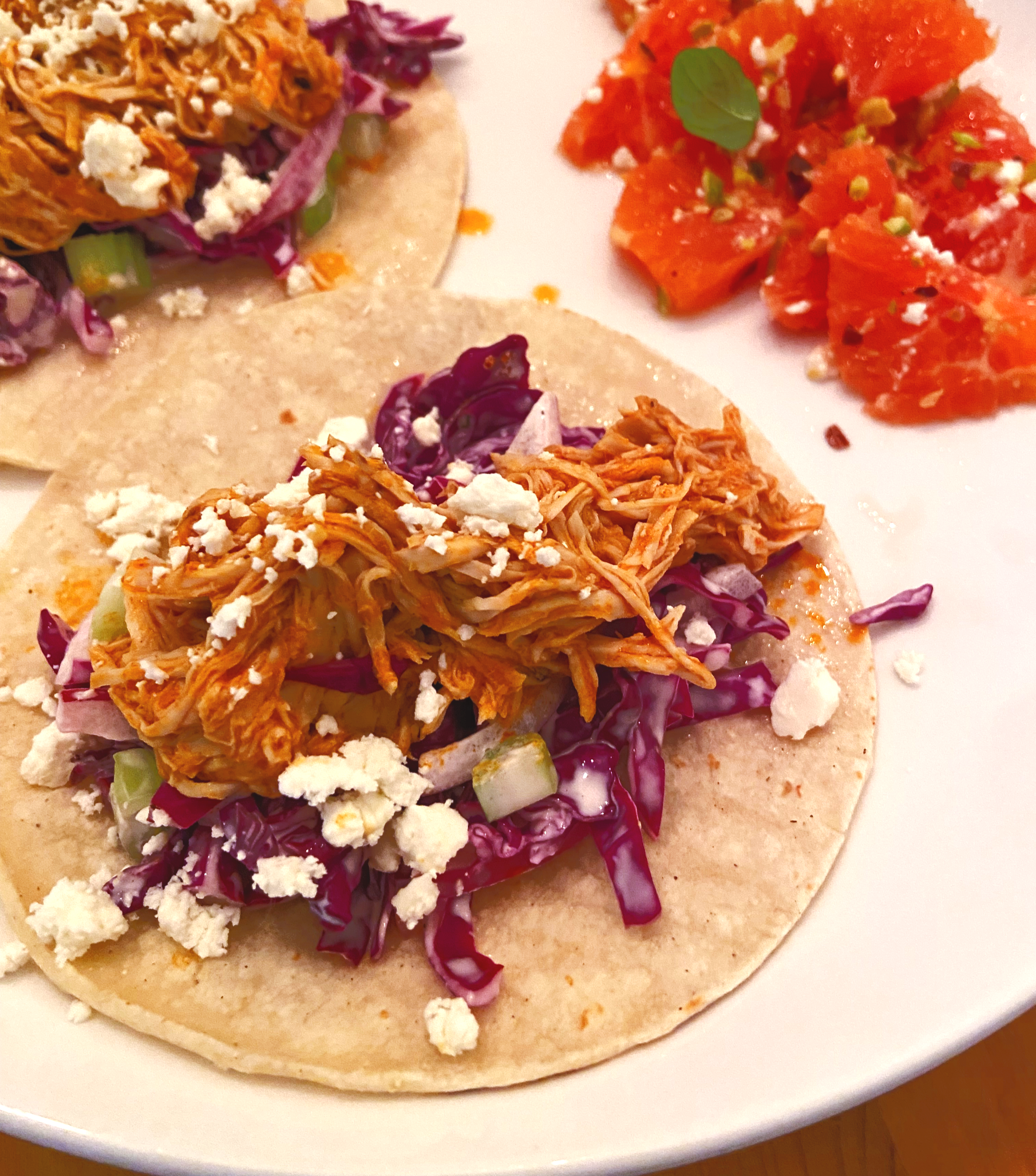 buffalo chicken tacos with crunchy slaw and cara cara orange salad