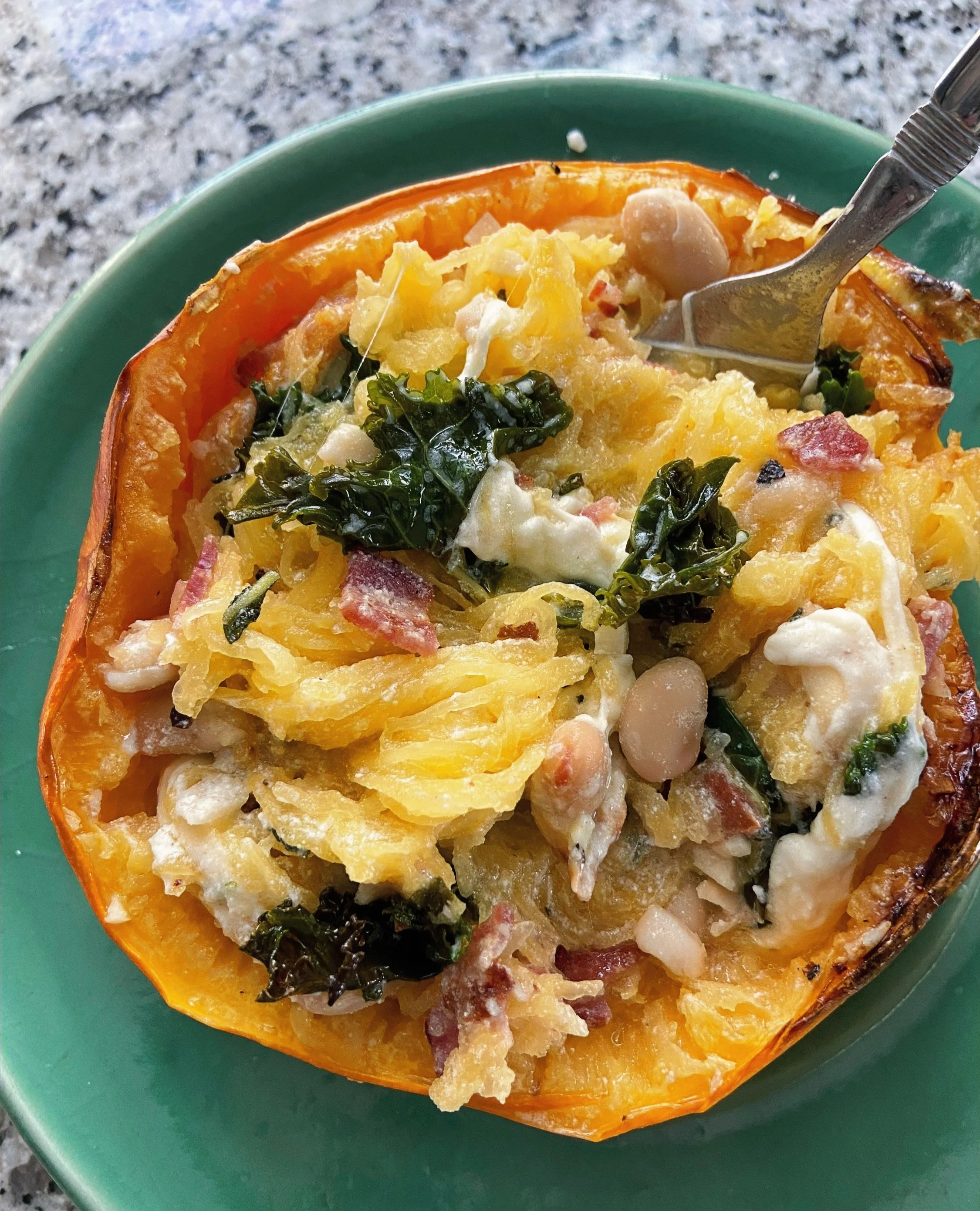 spaghetti squash with bacon, cheese, beans, and greens