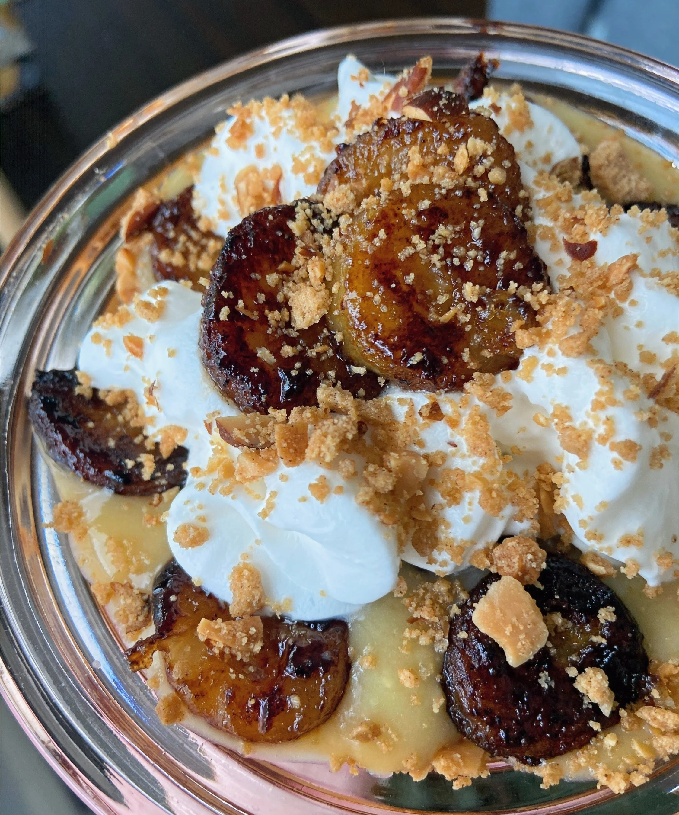 caramelized banana cream pie in a glass