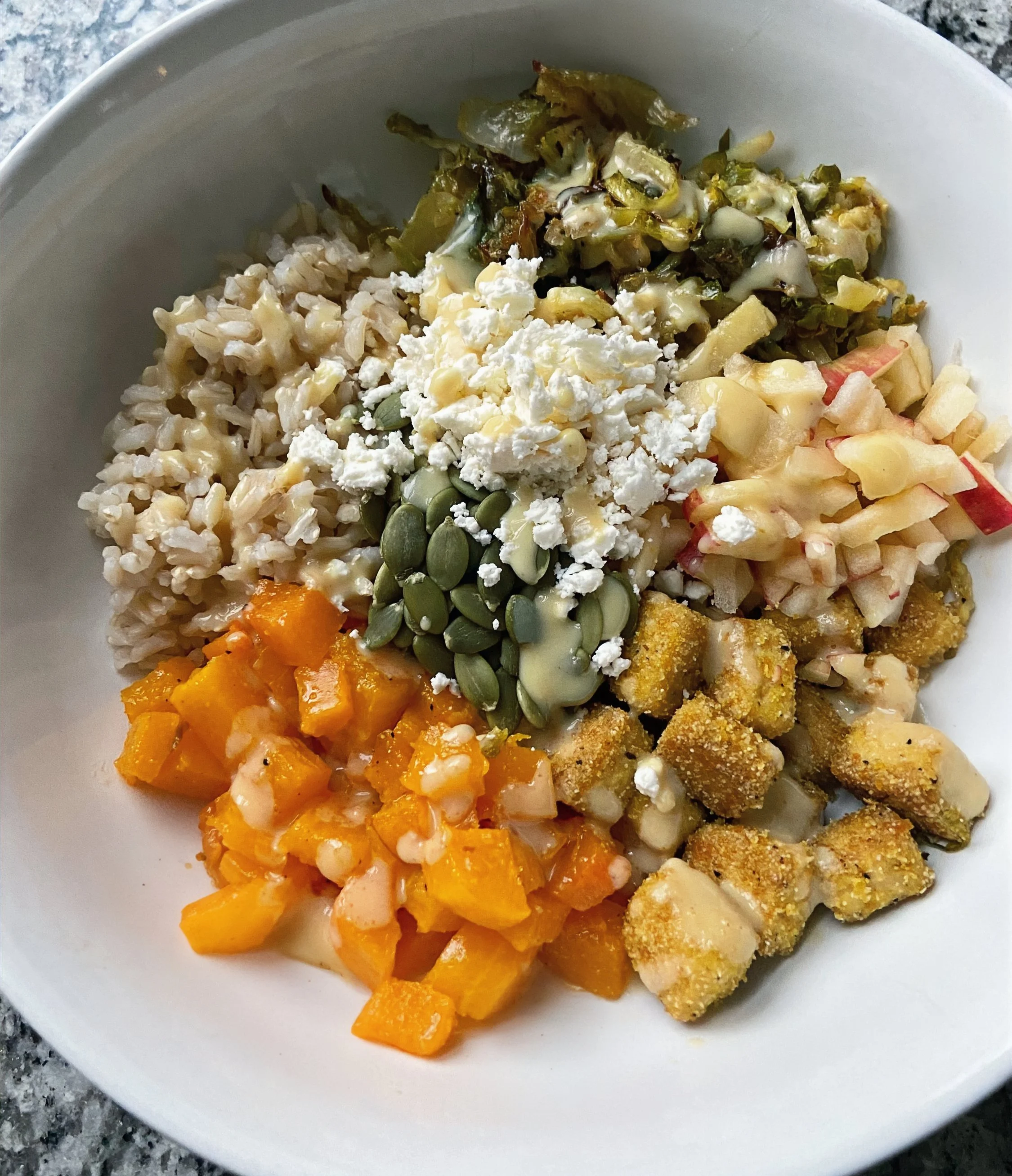 tofu bowl with roasted squash and maple dijon brussels sprouts