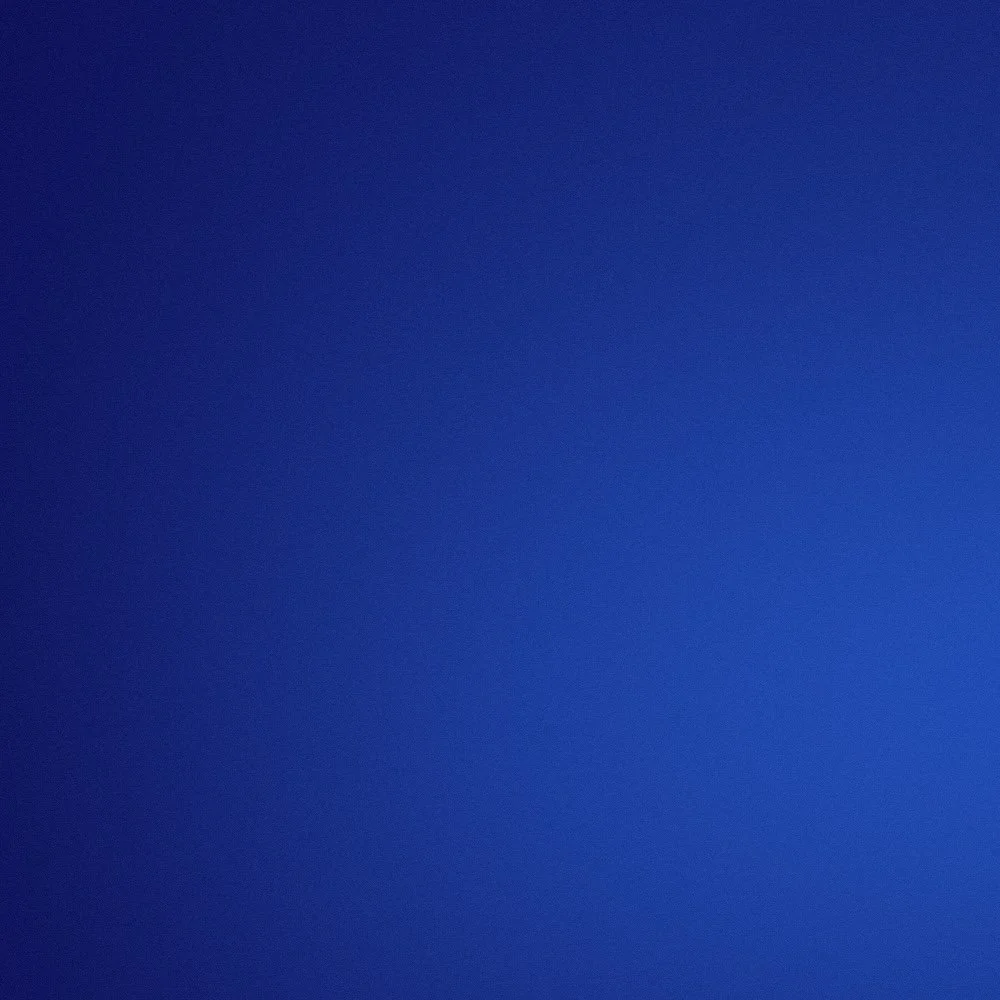 Solid blue background with no distinct objects or features.