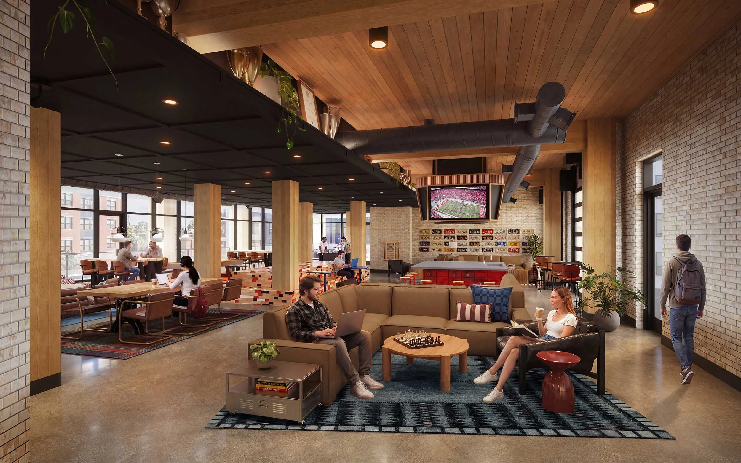 A modern indoor lounge area with brick walls, wooden ceiling, large windows, and various seating options. Several people are sitting and working on laptops or chatting. A large TV displays a football game. There are plants, decorative objects, and a coffee table with chess pieces.