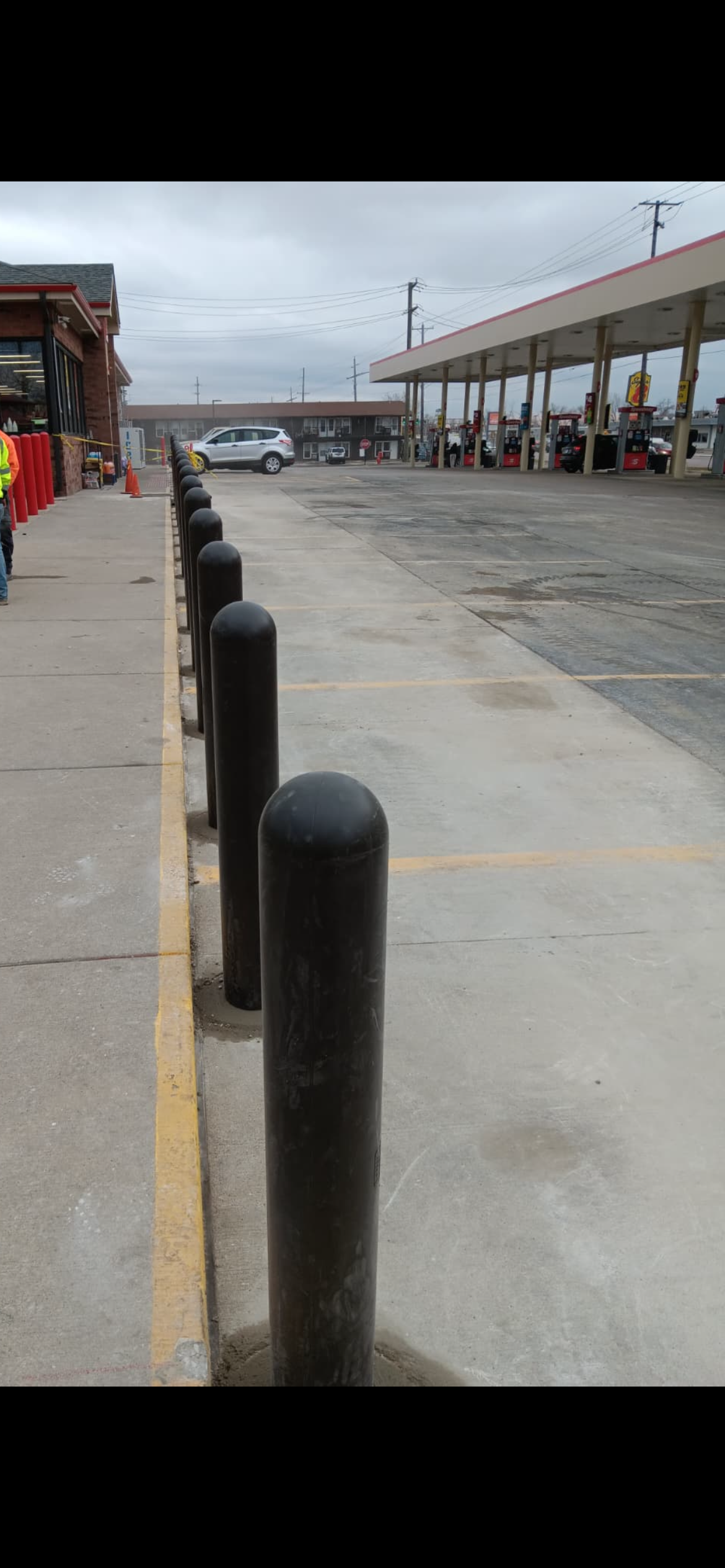 Concrete curbs and bollards installation in Elgin, IL for commercial property safety