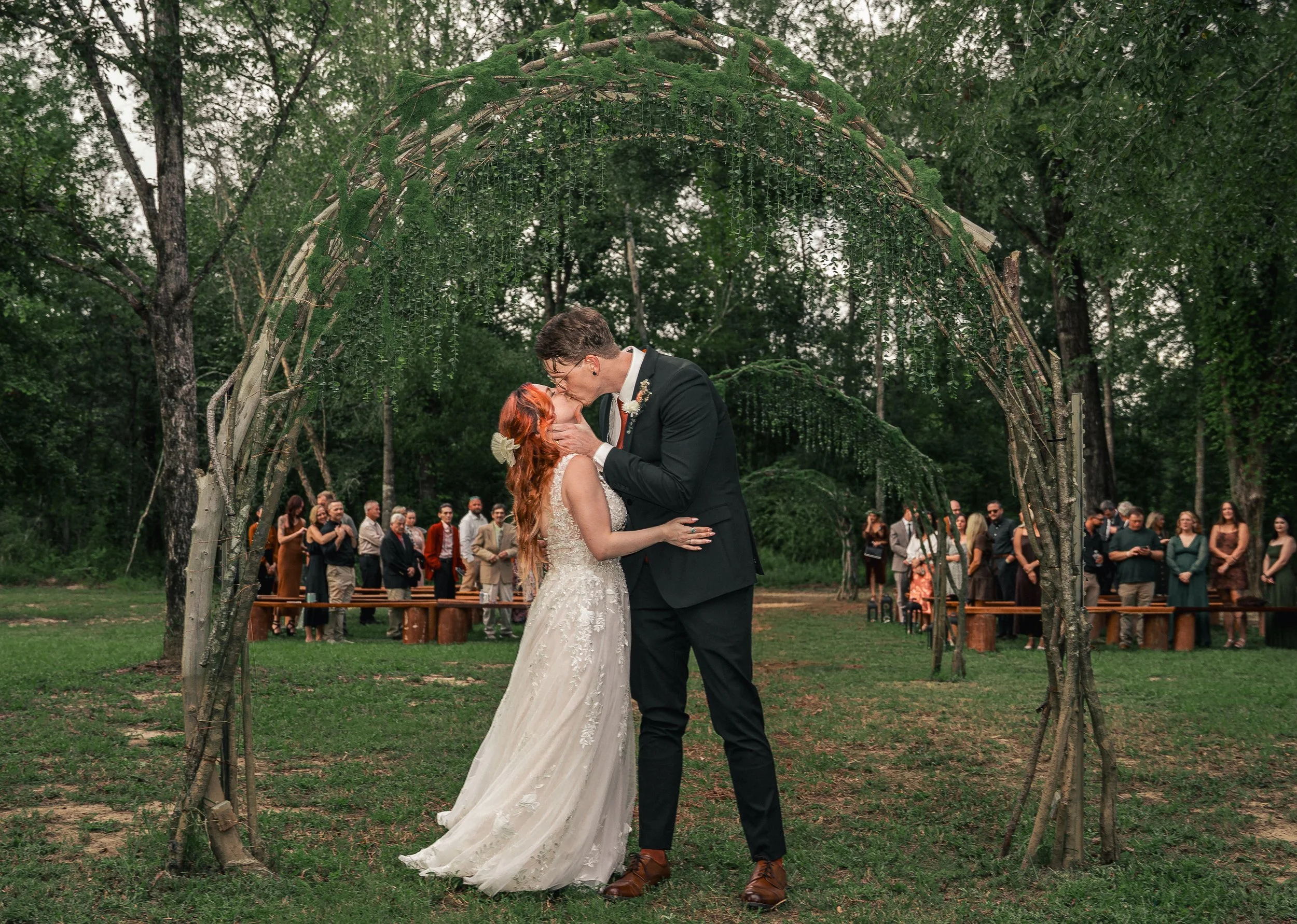 Benjamin and Ashley Ingermann kissing at the end of the aisle after getting married on Sept. 26 in Brewton, Ala. 