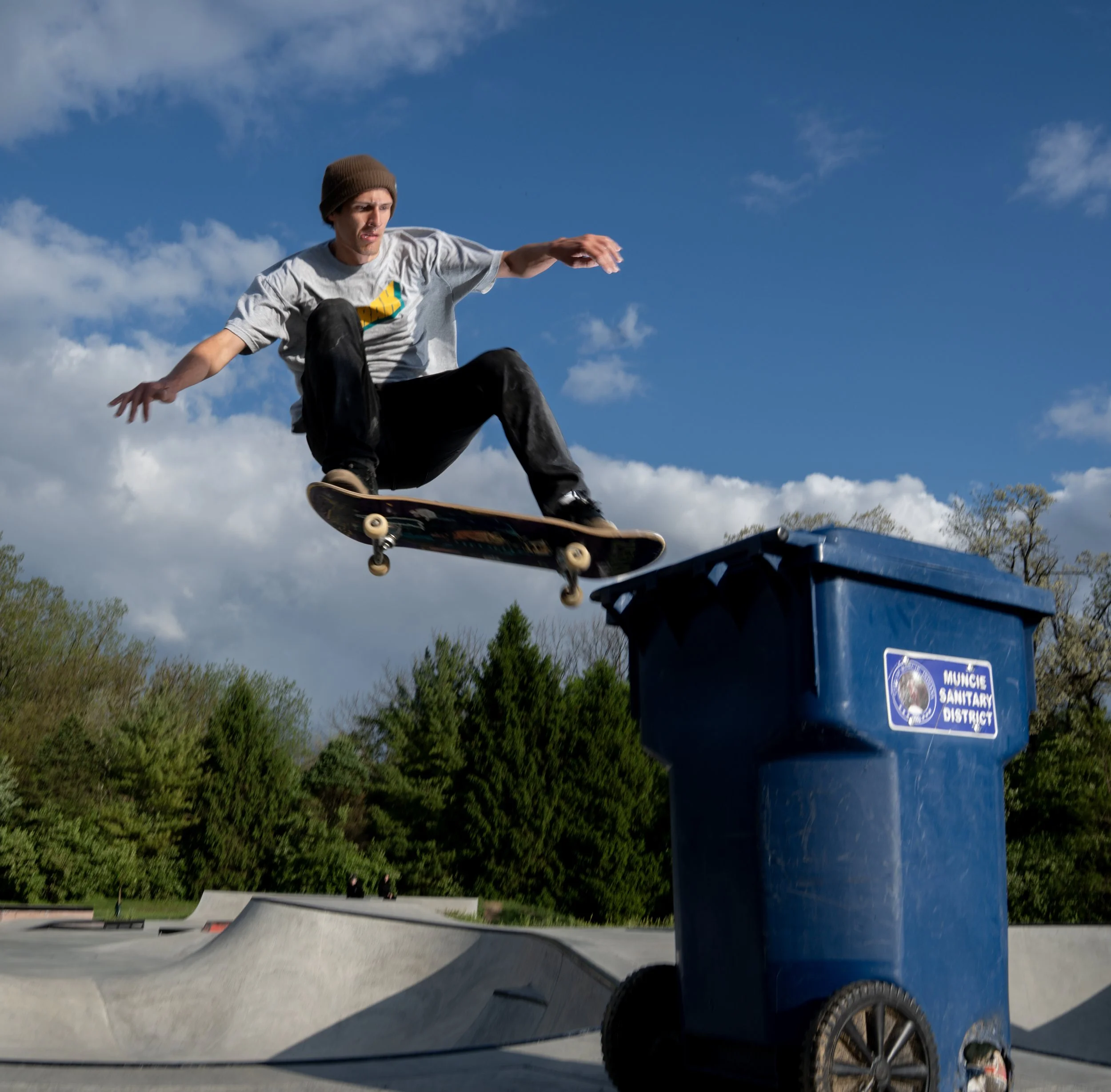 Muncie Skate Park attendee nose grinding a trashcan 