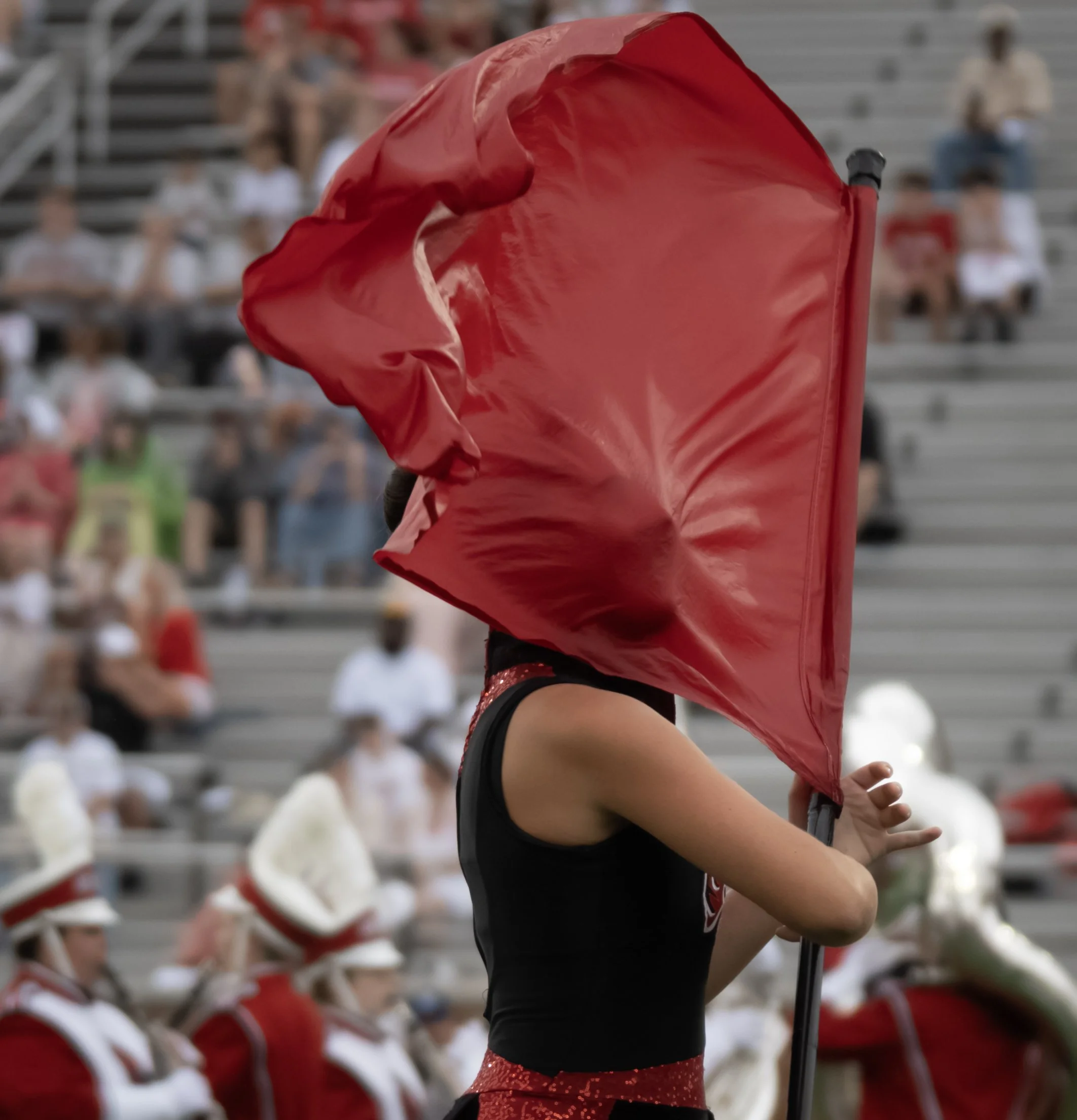 Ball State Color Guard member performs during the pregame show for Ball State football. Oct. 3 in Muncie, Ind.