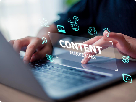 Person using a laptop with floating digital icons related to content marketing, SEO, and digital strategies.
