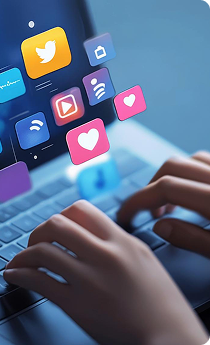 Person typing on a laptop keyboard with social media icons floating above, including Twitter, Facebook, and Instagram.
