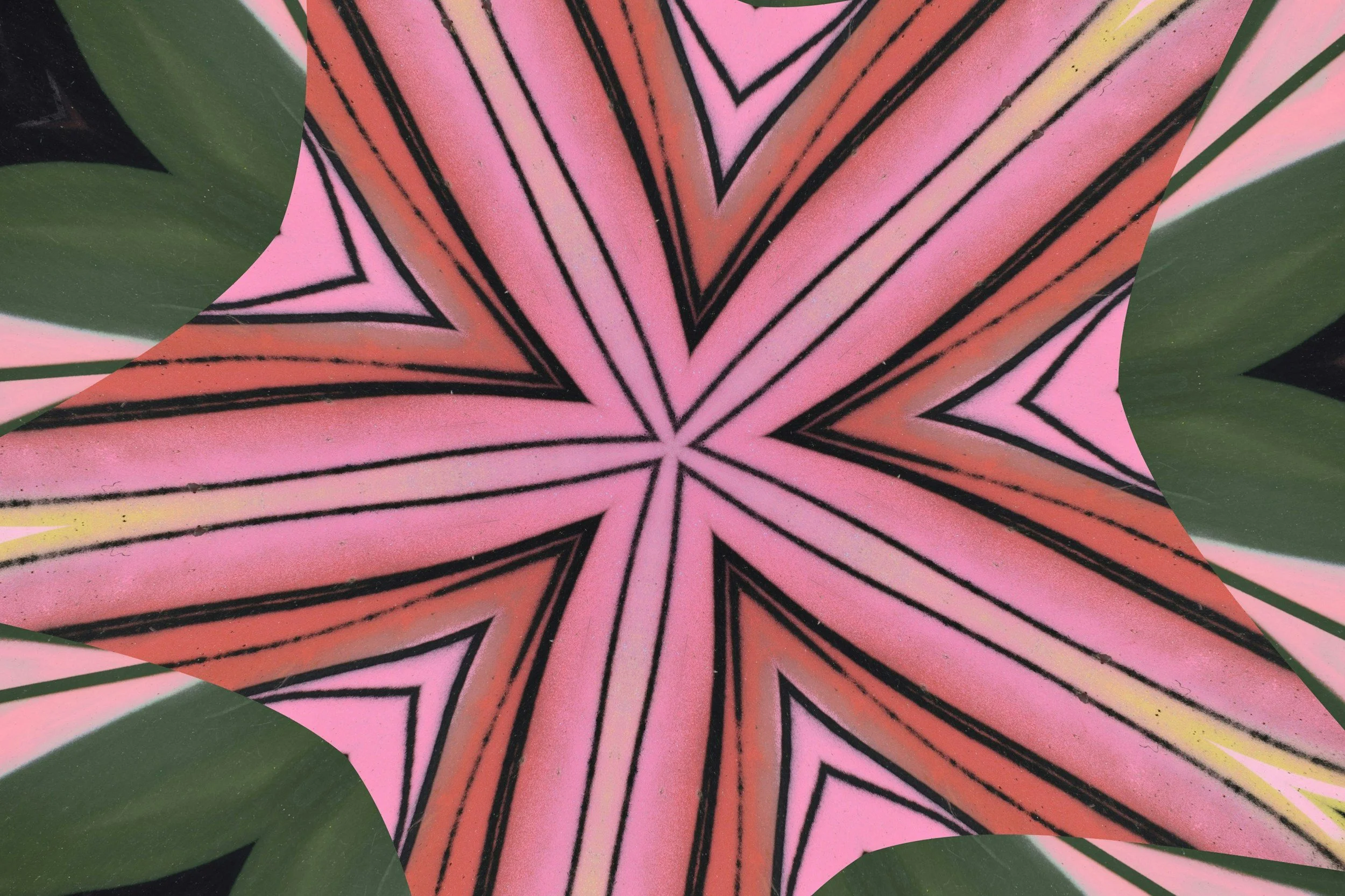 Close-up of a decorative pattern resembling a star or flower with pink, black, orange, yellow, and green colors.