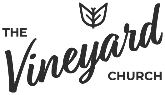 Logo of The Vineyard Church featuring a stylized leaf above the text