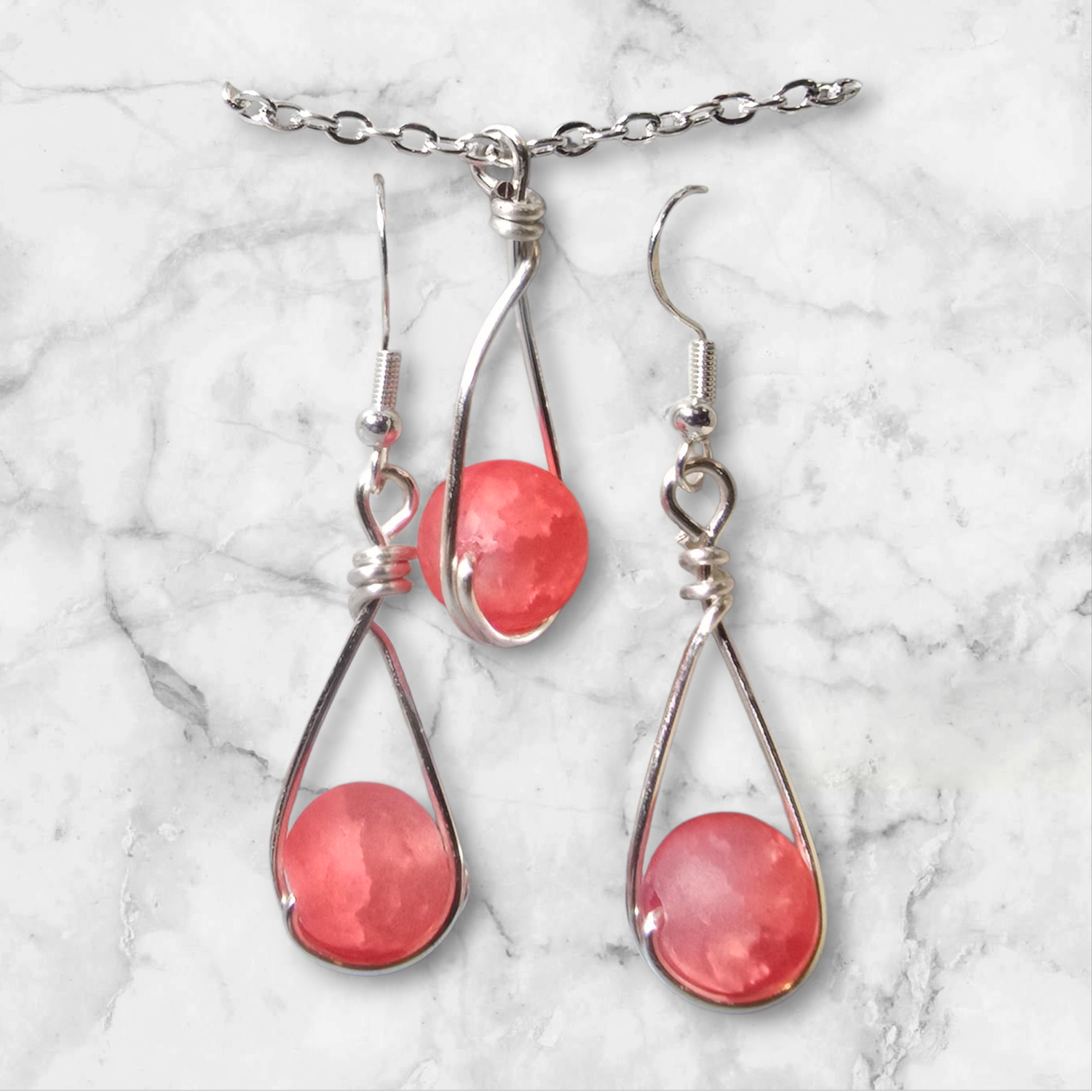 Matte red glass bead with silver set