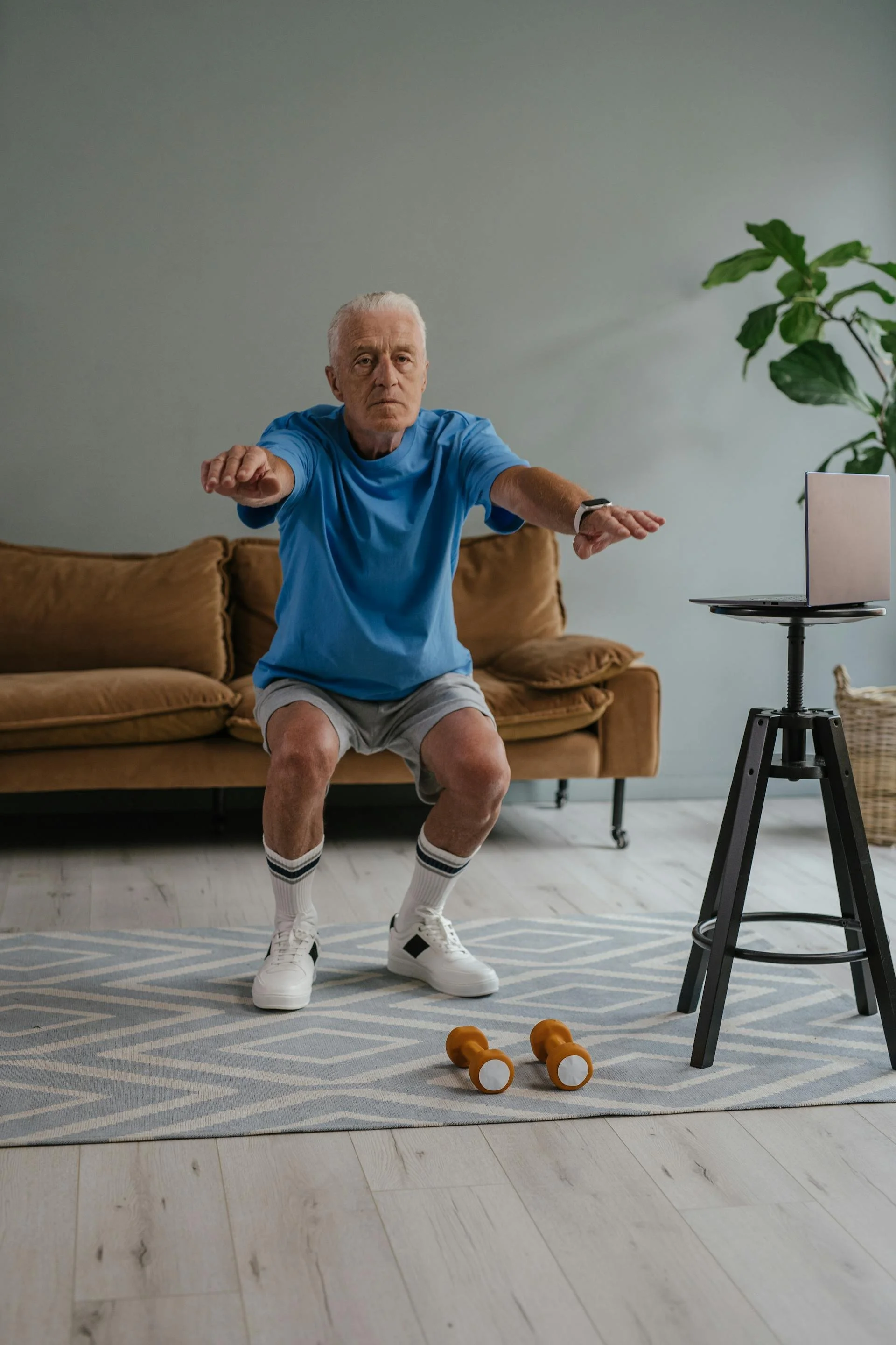 Old man exercising at home