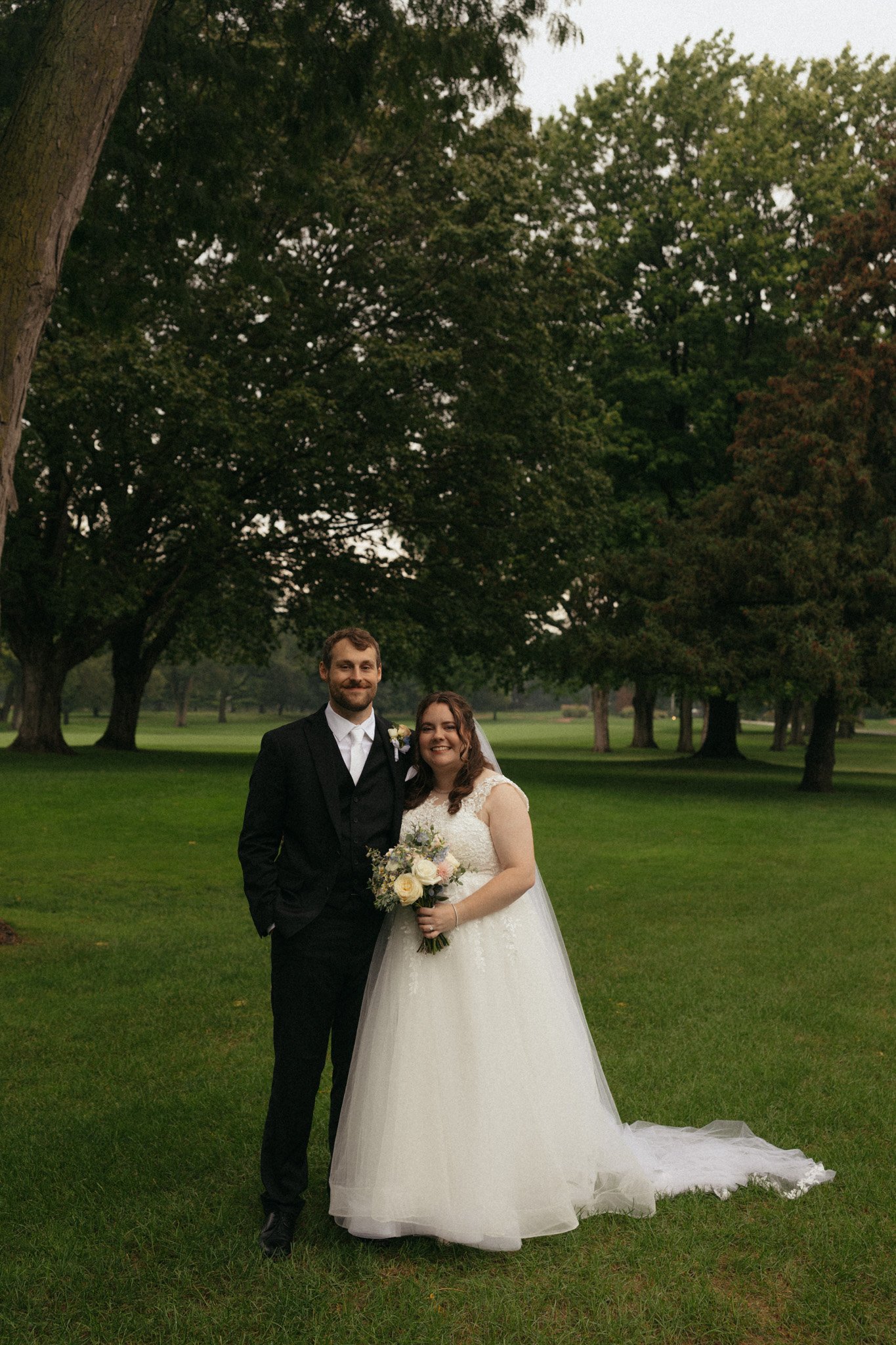 Rainy wedding day portrait by Chicago Catholic wedding photographer