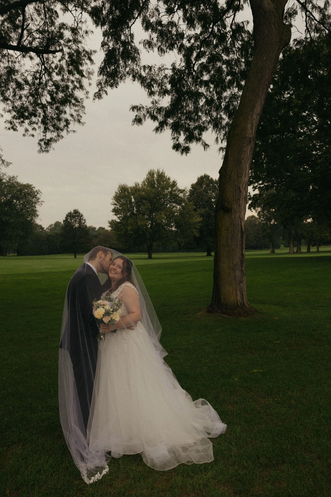 Rainy wedding day portrait by Chicago Catholic wedding photographer