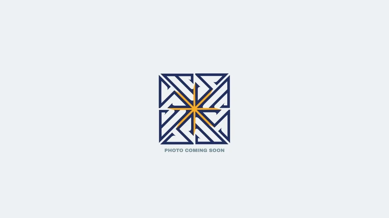 Placeholder image with a blue and gold geometric pattern and the text "Photo Coming Soon".