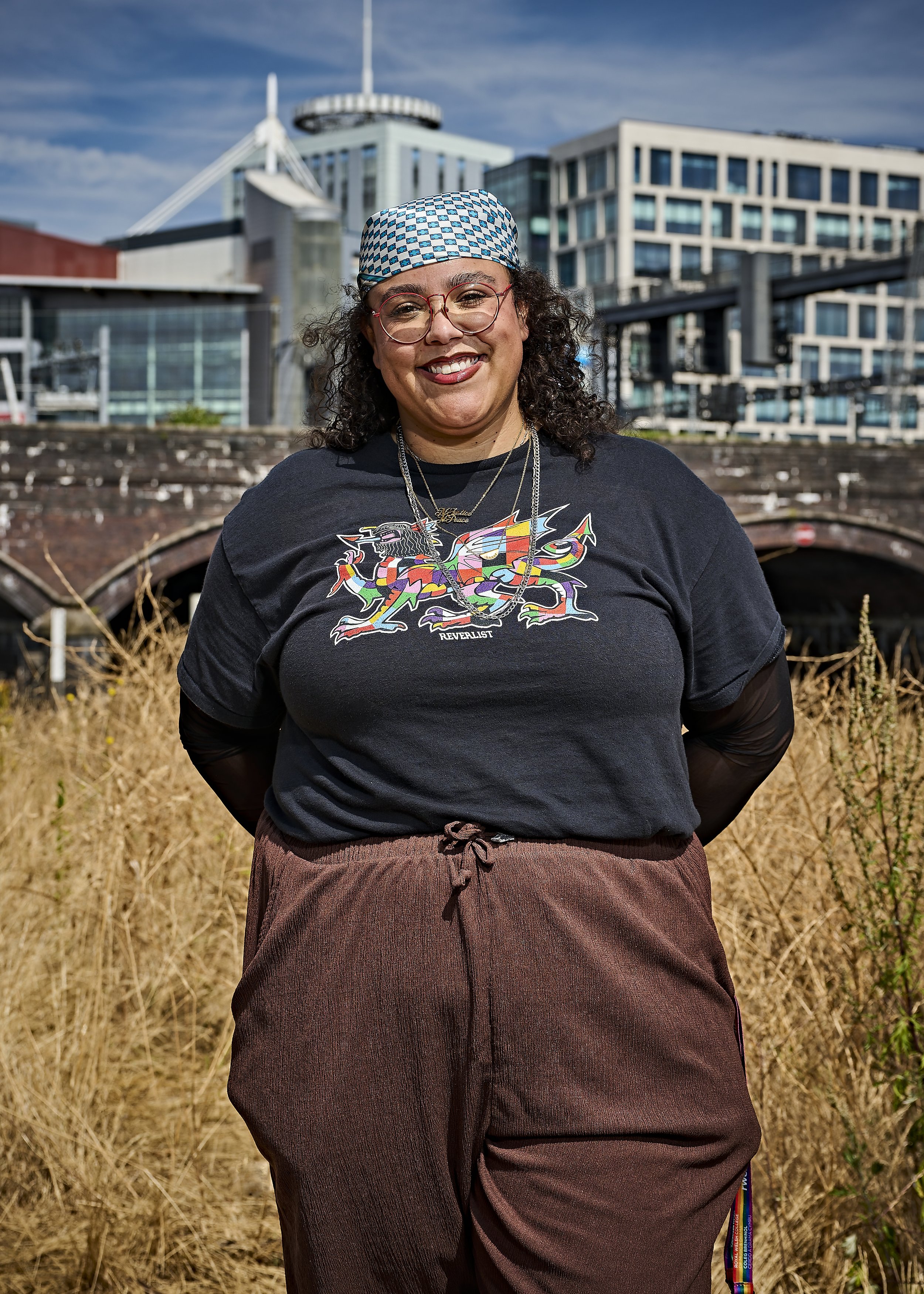 smiling image of tara turner wearing blacks and browns