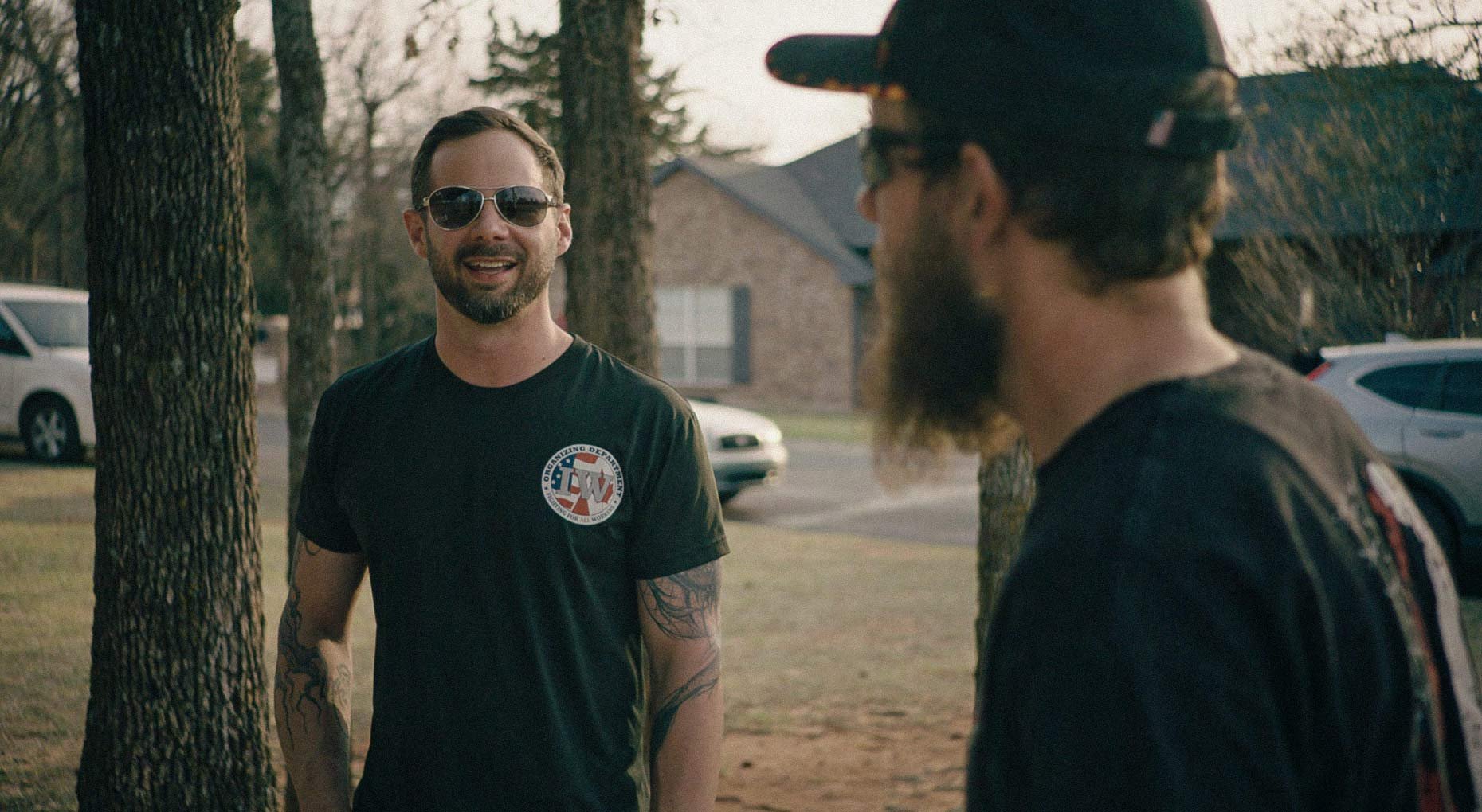 A portrait of Trey Martin, candidate for Congress in Oklahoma's 5th Congressional District, talking with a voter.