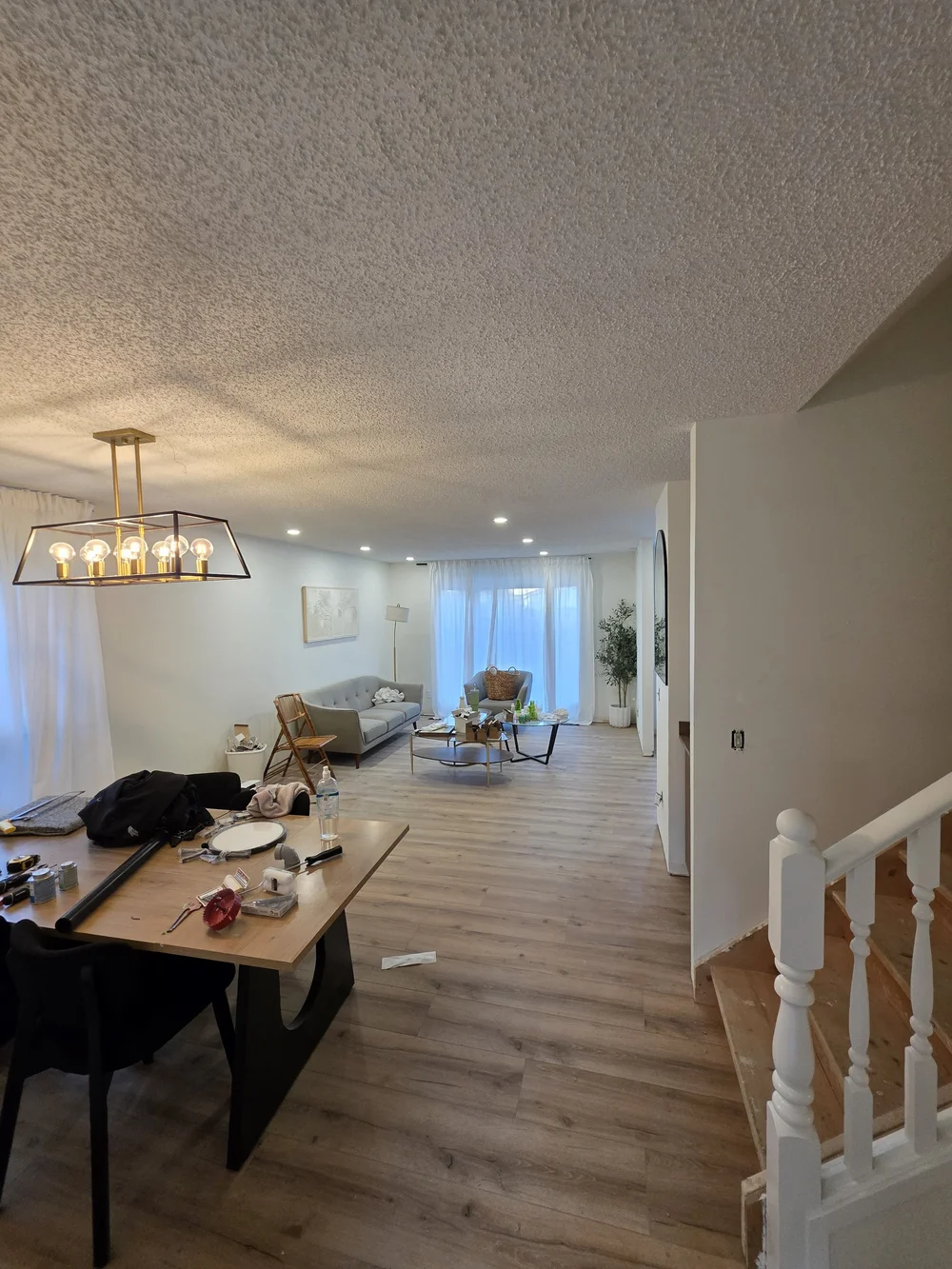Dining room chandelier and pot lights by Raylum Lighting