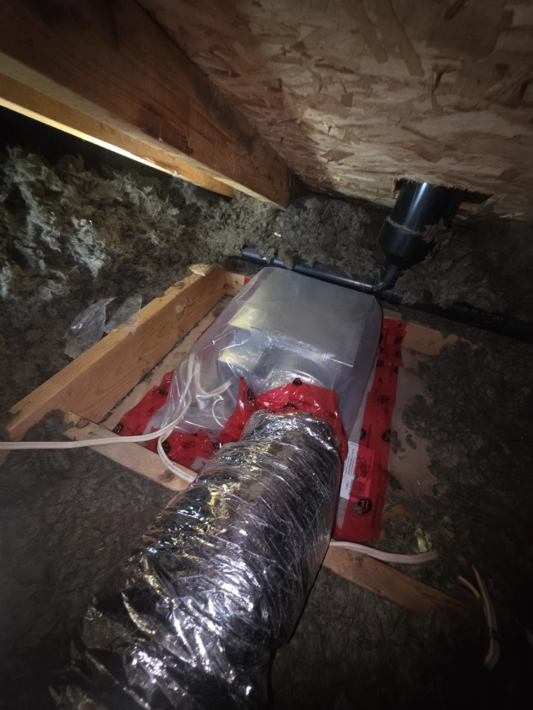 Bathroom fan sealed with vapor barrier in attic Edmonton
