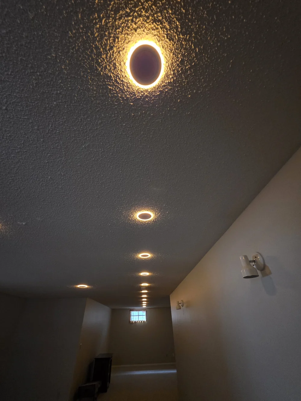 Slim LED wafer pot light installed in place of an old can light