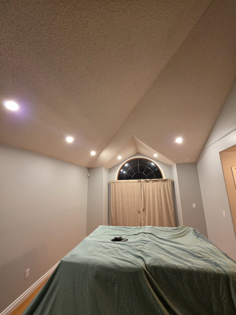 Vaulted bedroom pot lights by Raylum Lighting