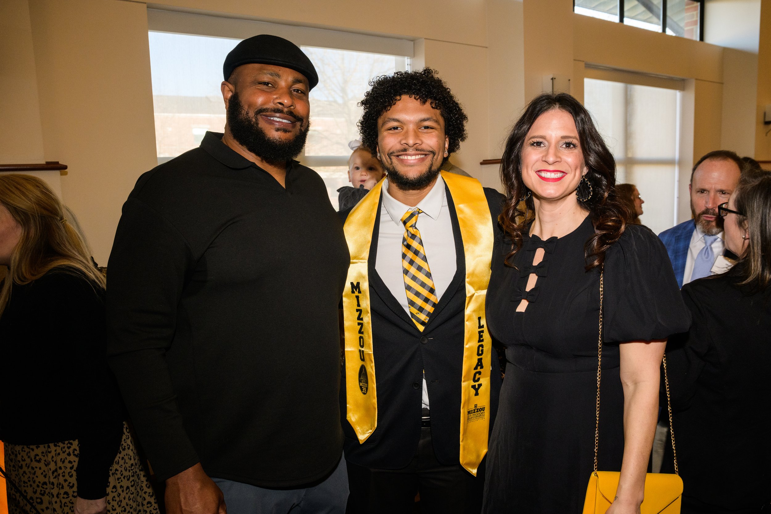 Mizzou Legacy student, Tyson Ellison, poses with his parents, 'Atiyyah Ellison and Jessica Ellison, as he accepts the Mizzou '39 Award, one of the most prominent recognitions a student can receive at the University of Missouri School of Journalism.