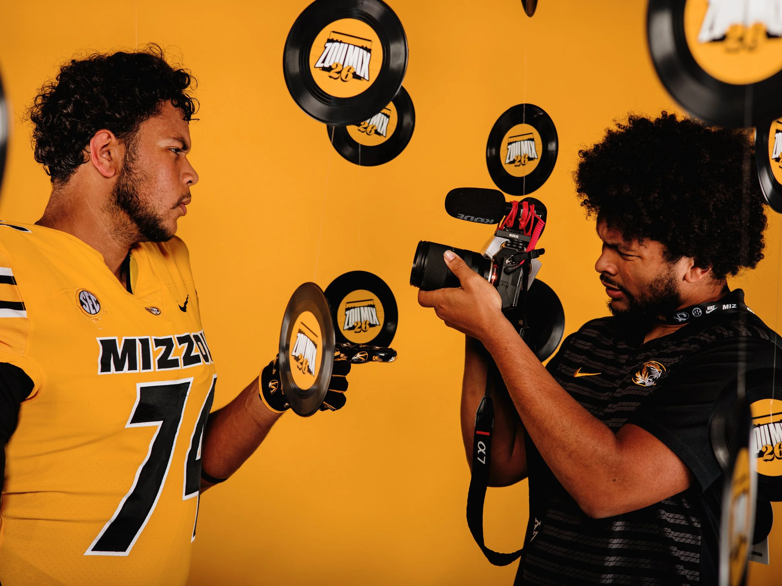 Tyson Ellison poses as if taking video of his brother, Braylon Ellison, during his official visit at Mizzou Football. Braylon Ellison, four-star offensive line recruit out of high school, joined the Tigers in January 2026.