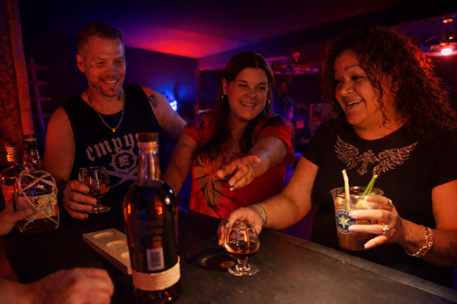 Guests enjoy tropical cocktails and rum flights in a themed tiki bar.