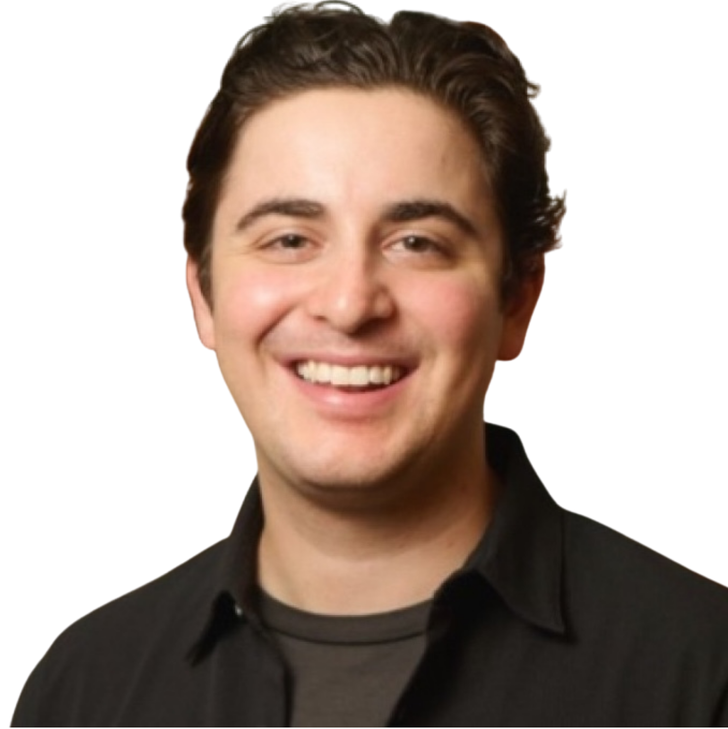 Black and white portrait of a smiling young man with dark, wavy hair, wearing a dark collared shirt, with a colorful yellow and green decorative element in the background.