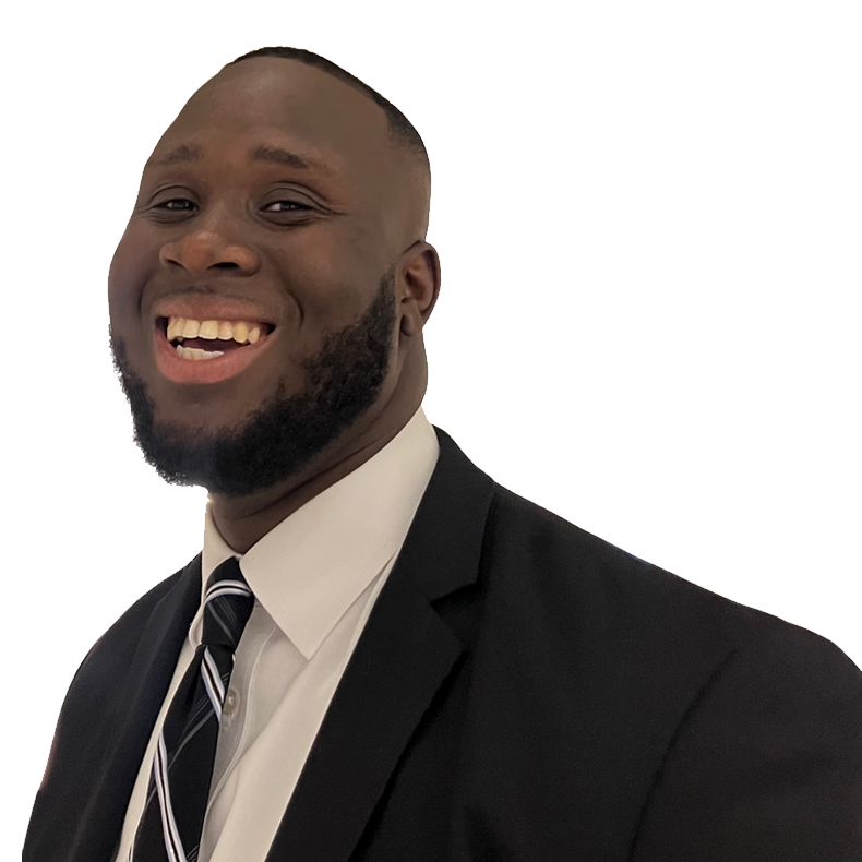 A smiling African American man in a black suit, white shirt, and striped tie.