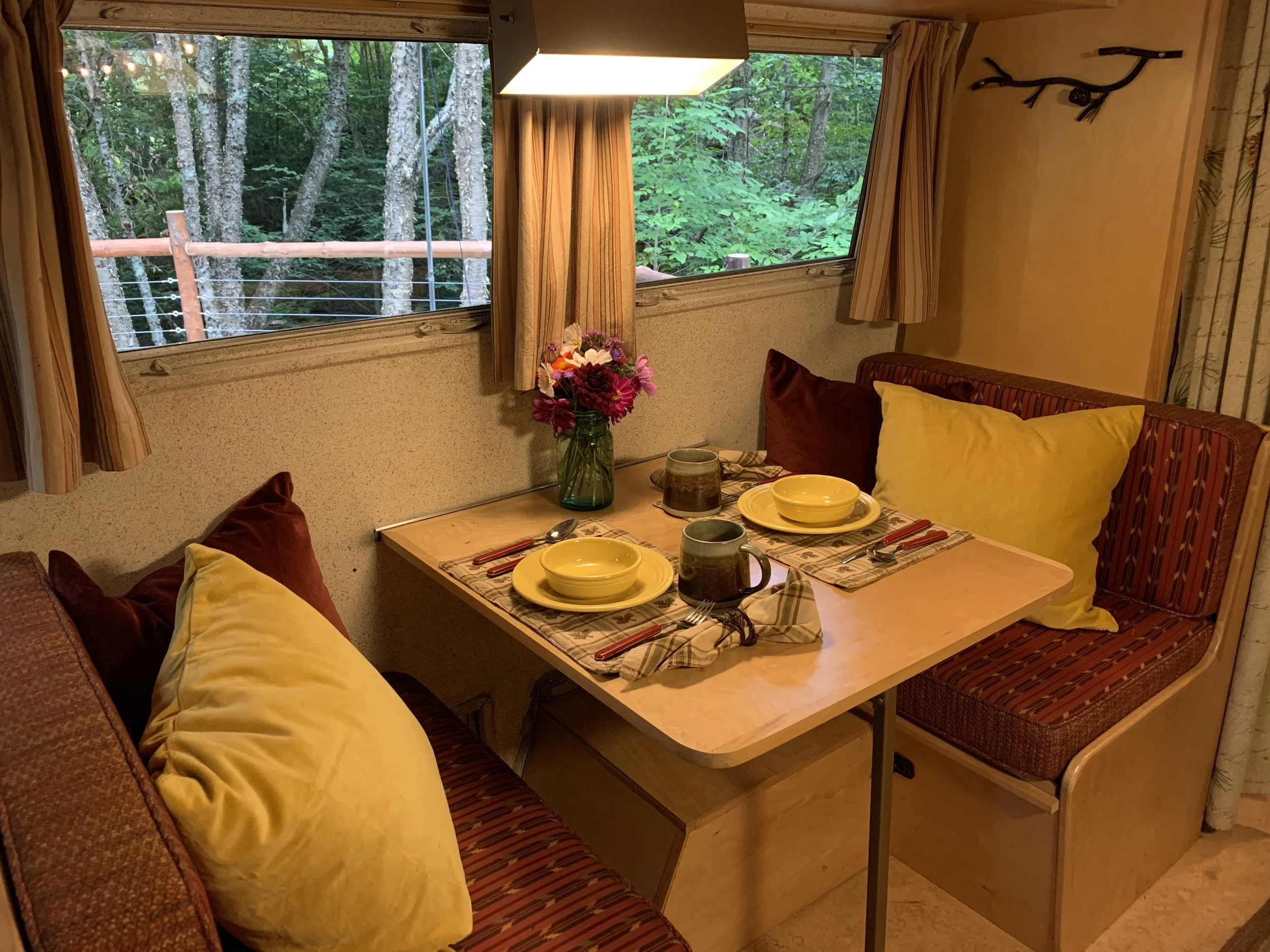A dining table that easily converts into a third sleeping space.