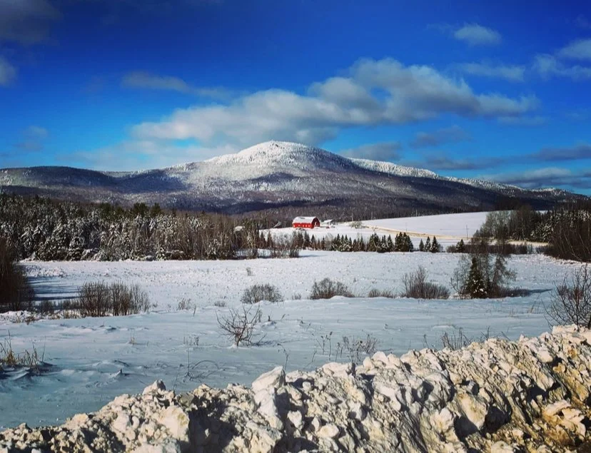 Winter across the fields and mountains.