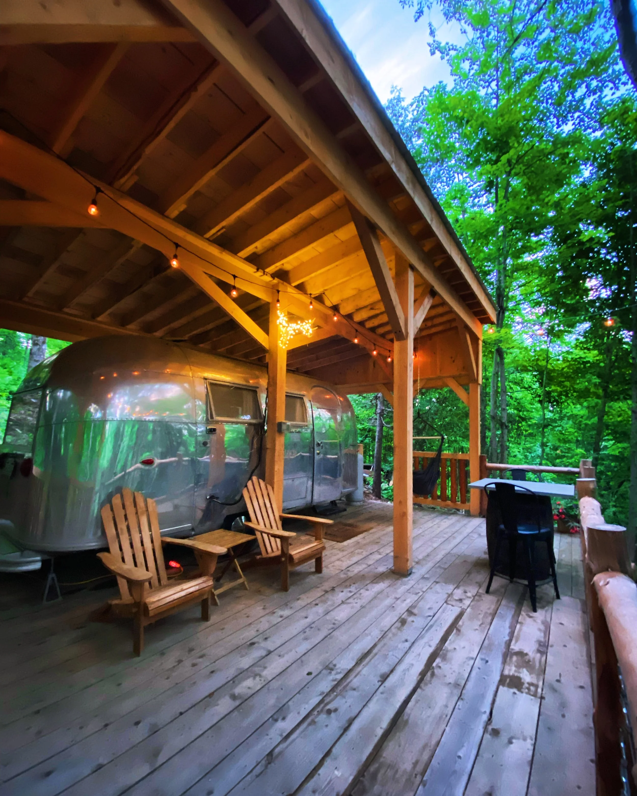 As night falls, the space takes on a softer glow.