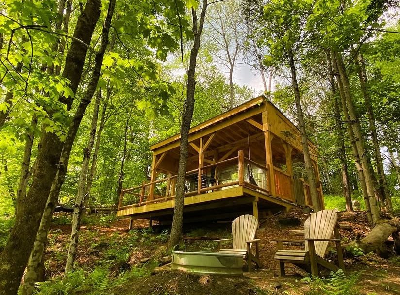 Tucked into the woods, with nothing but the sound of the brook nearby.