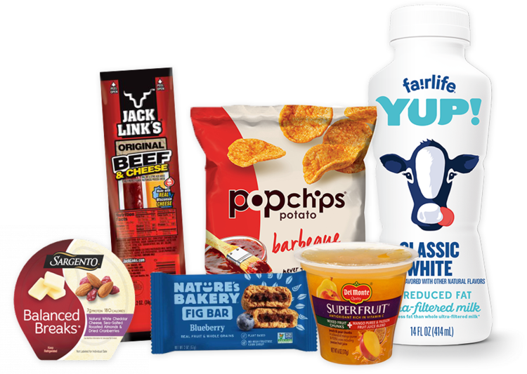 Assorted snacks and beverages including Jack Link's beef jerky, Pop Chips potato chips, a bottle of Fairlife milk, Sargento Balanced Breaks snack pack, Nature's Bakery fig bar, Del Monte fruit cup, and a container of yogurt.