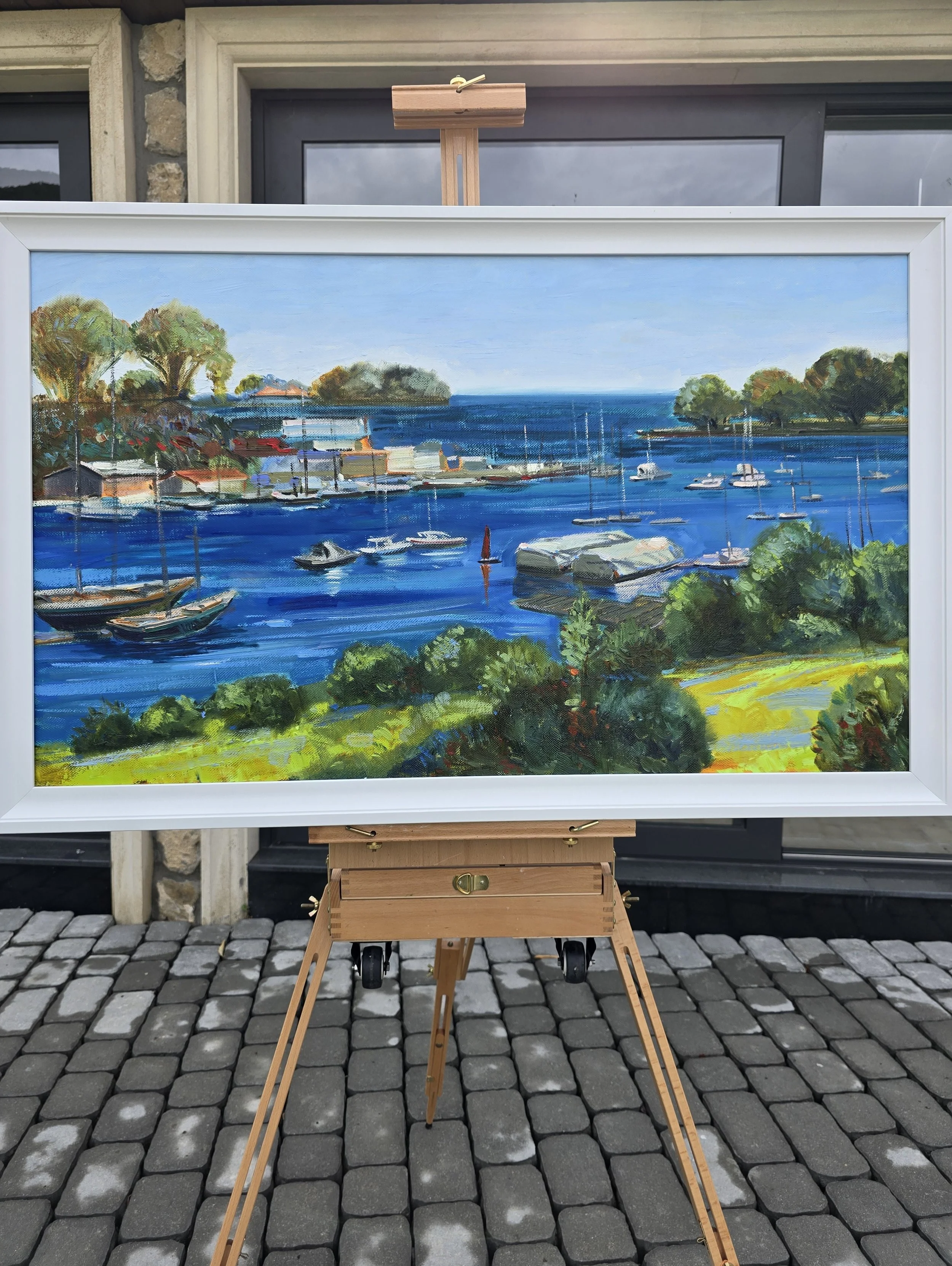 seascape oil painting with boats displayed in modern interior wall decor