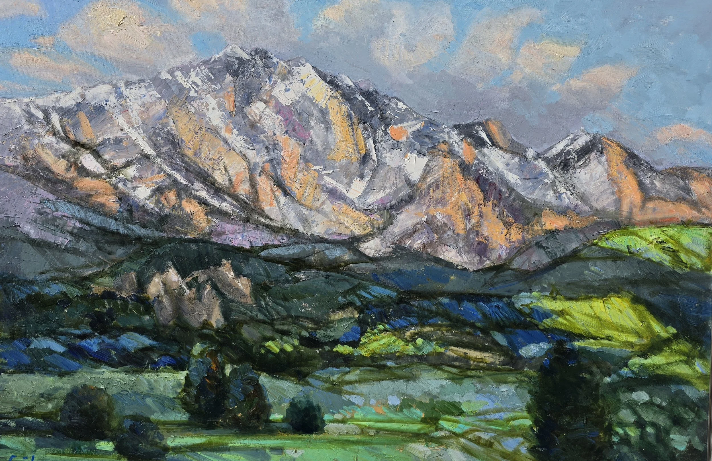 A colorful painting of a mountain range with snow-capped peaks, green foreground, and a partly cloudy sky.