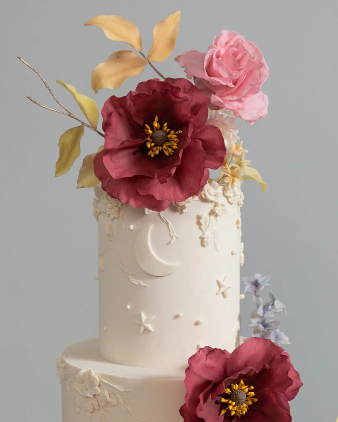 Detail of Burgundy Sugar Flowers on a White Night Sky Wedding Cake New York