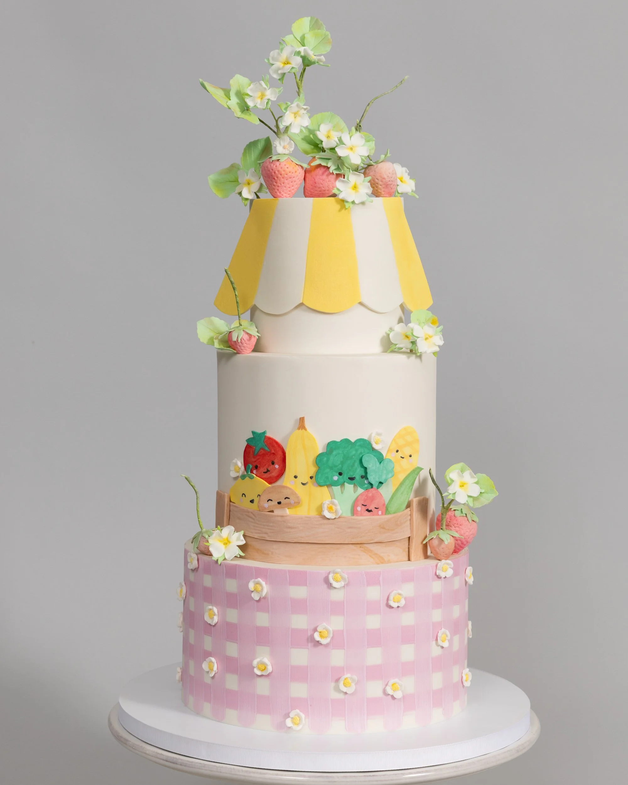 Farmer's market birthday cake with pink gingham happy vegetables strawberries