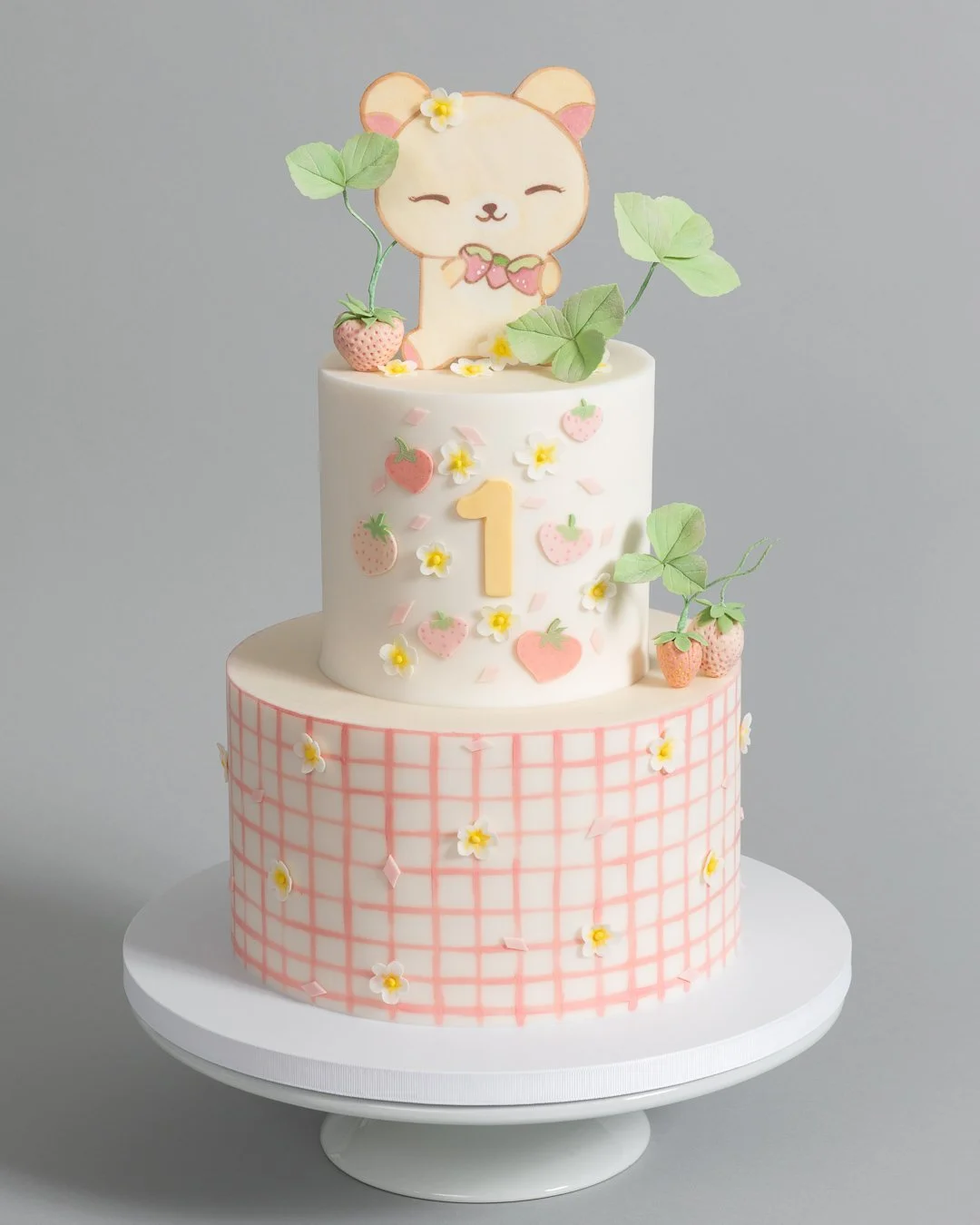 Kawaii first birthday cake teddy bear strawberries and gingham tier Brooklyn