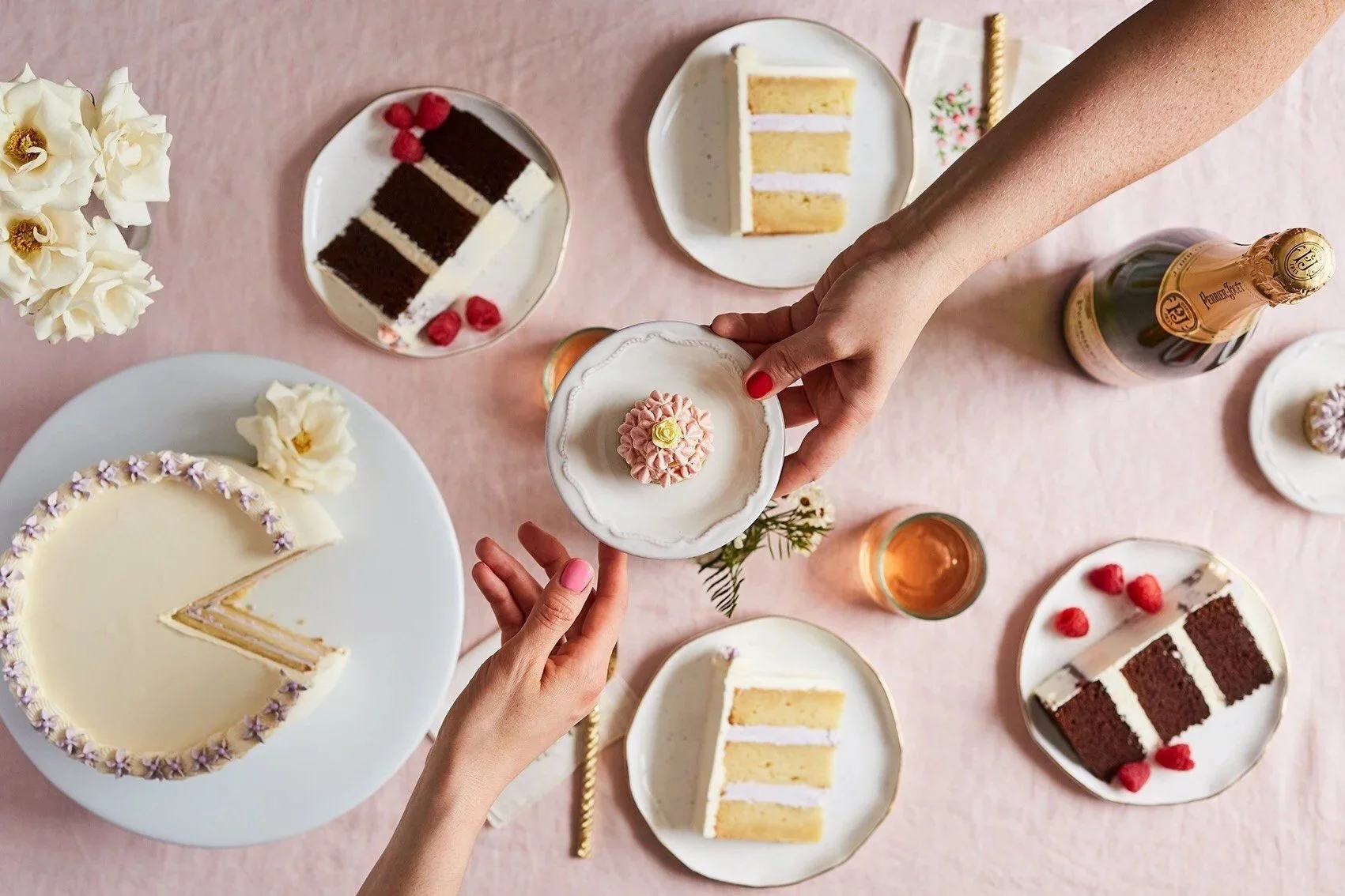 Women's hands handing a plate of cake to each other Cake Hero