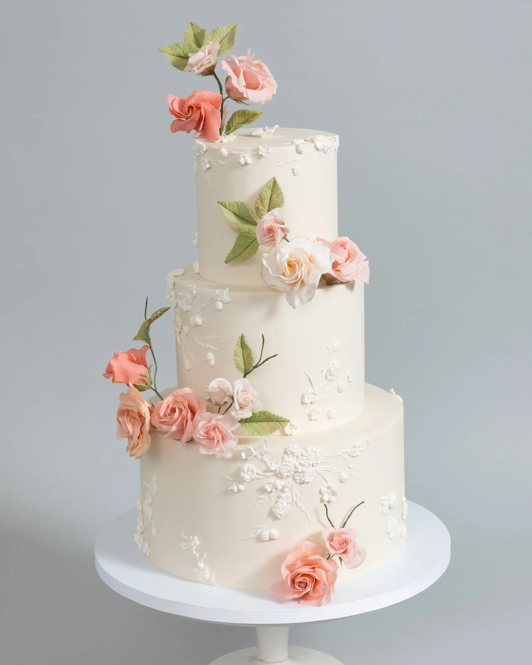 Three Tier Wedding Cake with Pale Peach and Pink Roses