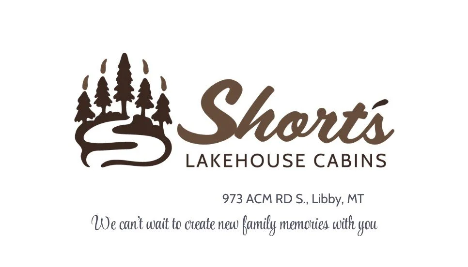 Business card for Shorts Lakehouse Cabins featuring a logo with trees and a winding path, with contact information and a message about family memories.