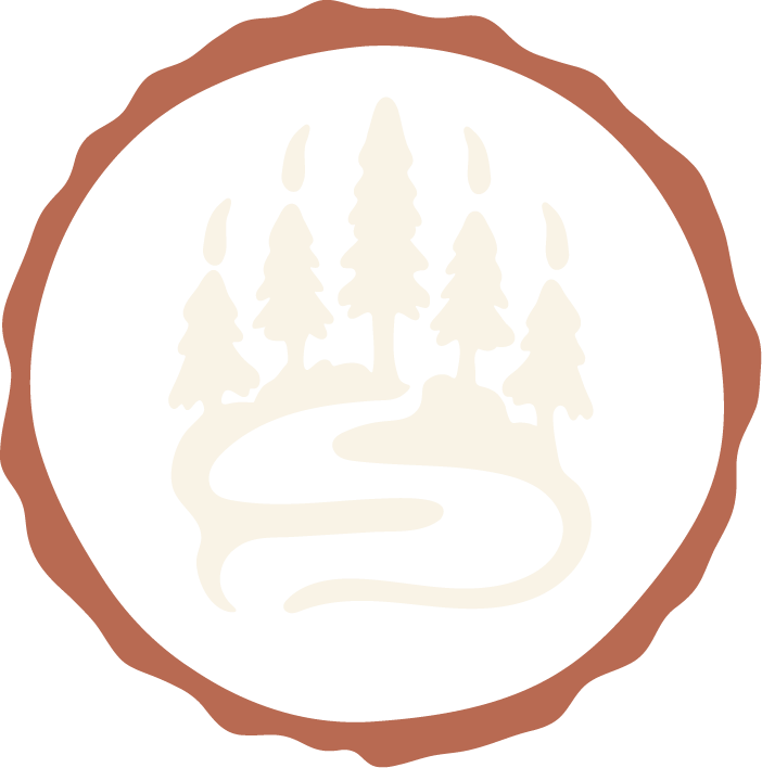 Silhouette of a forest with trees and a winding river inside a circular border.