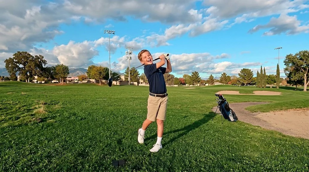 Child Swinging a Golf Club