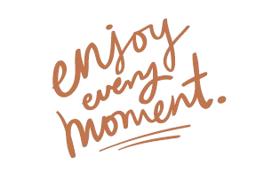 Handwritten text that says, 'enjoy every moment.'